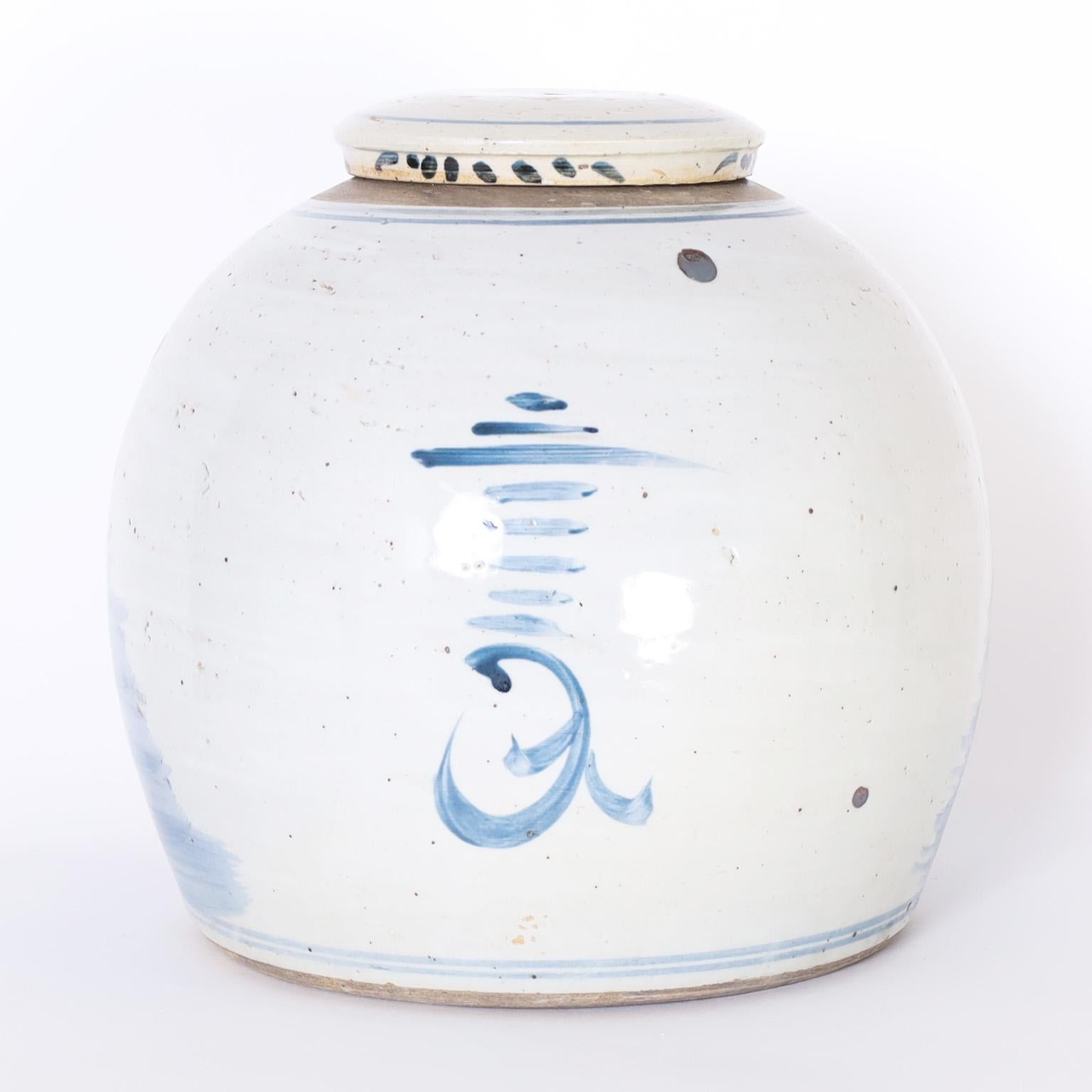 Pair of Chinese Blue and White Porcelain Lidded Jars with Pheonix Birds In Good Condition In Palm Beach, FL