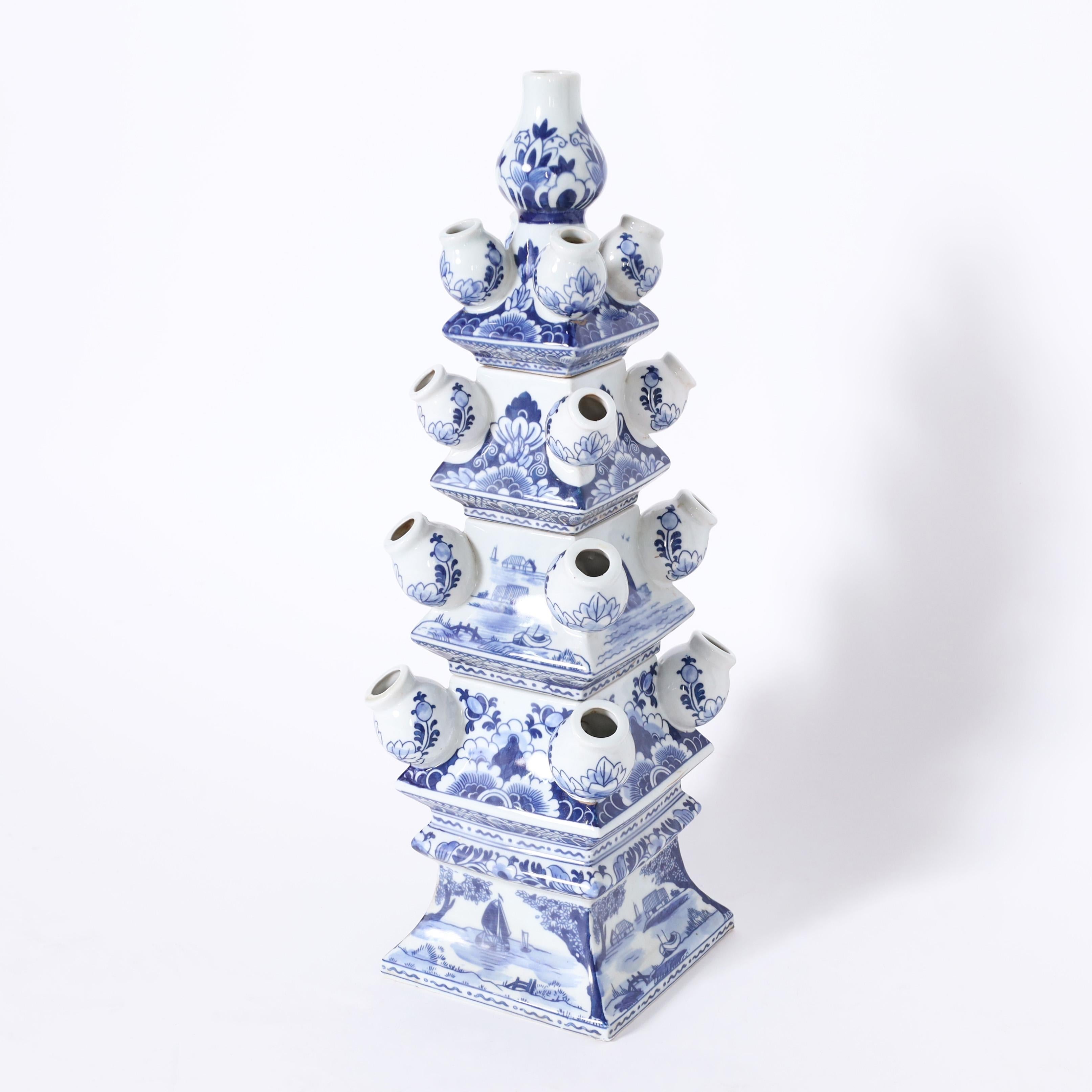 Enchanting pair of Chinese blue and white crafted in four pieces each with sixteen openings and hand decorated with floral and landscape designs.