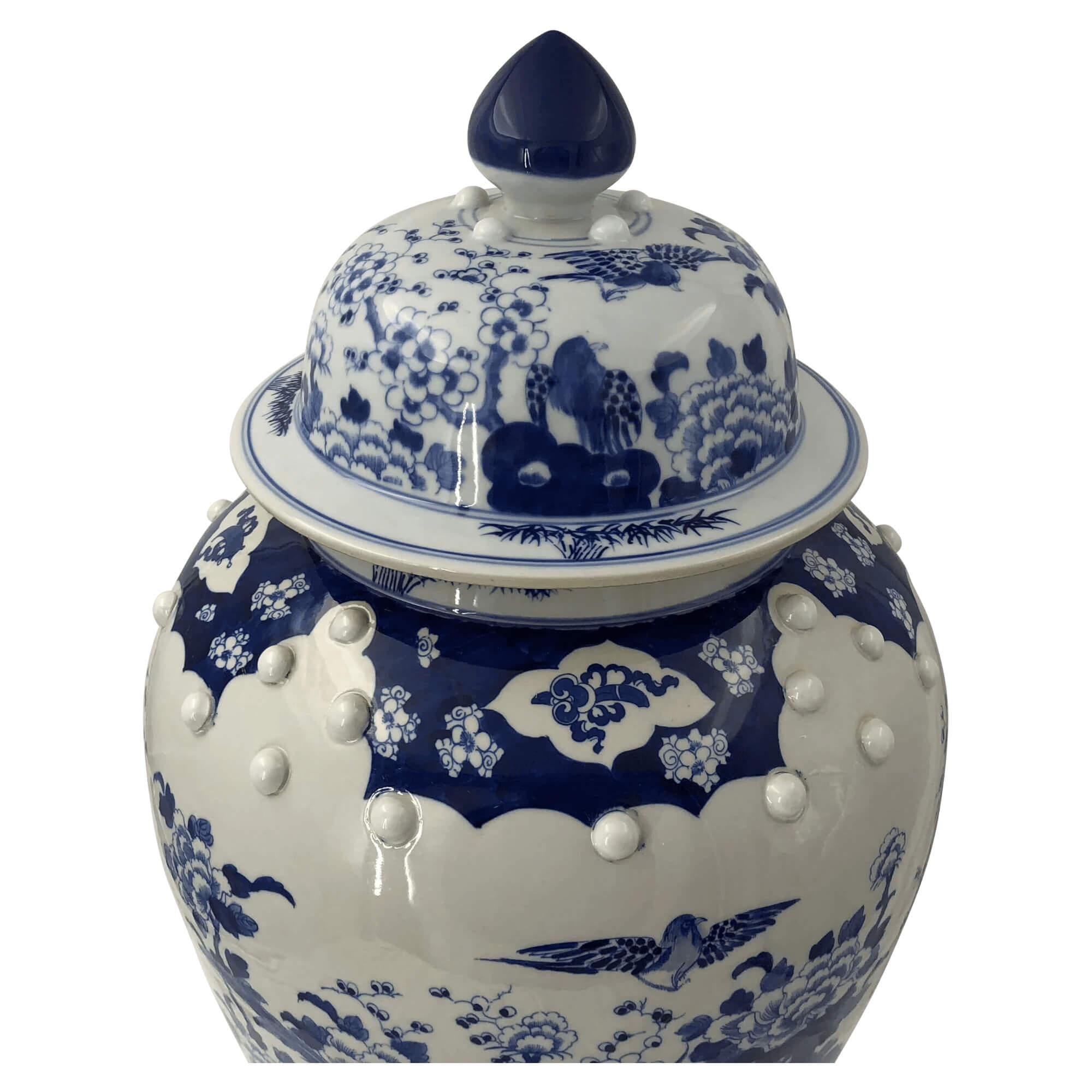Chinese blue and white hand-painted ceramic lidded Temple jars decorated with flowers and birds.

Dimensions: 15