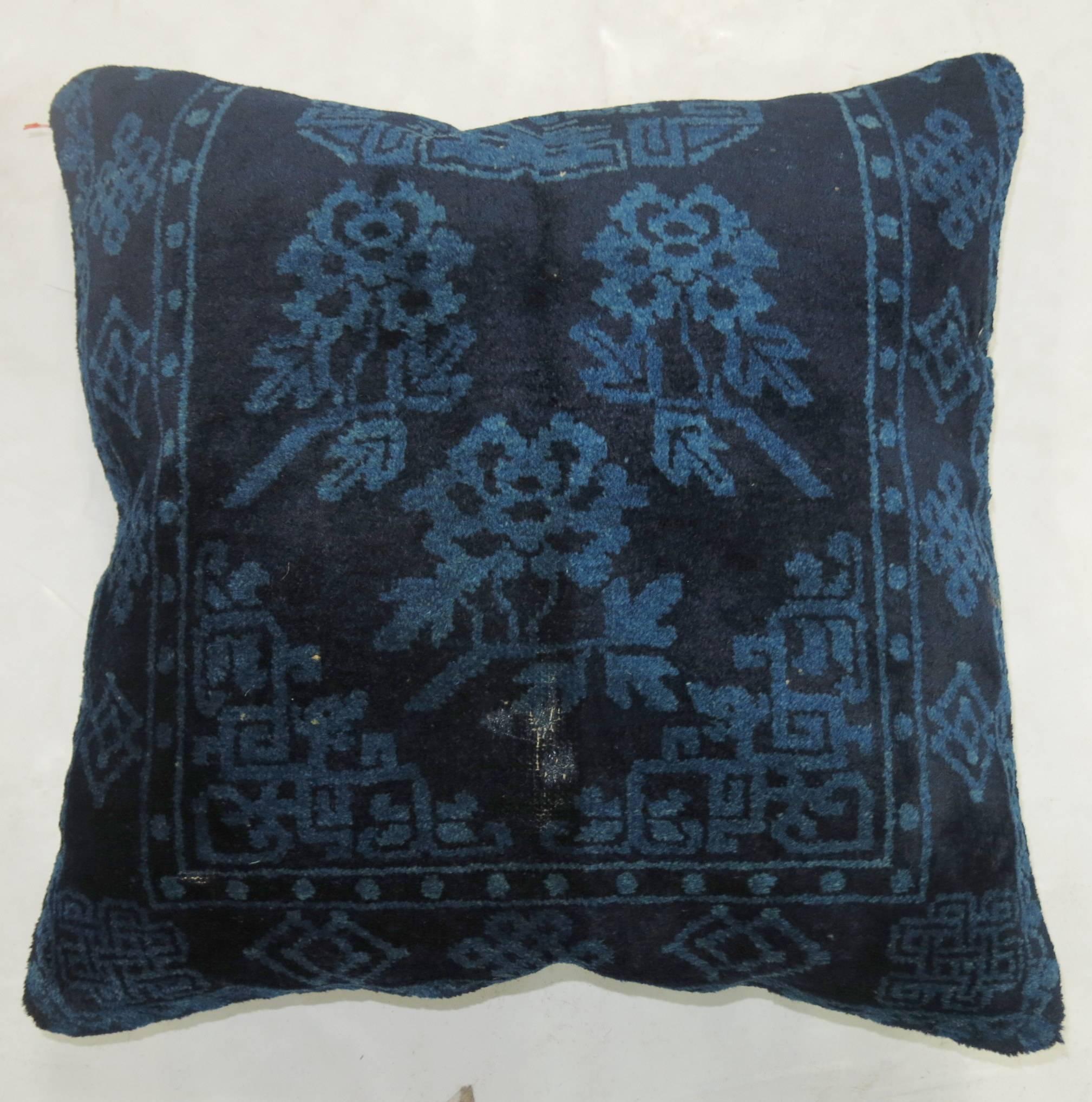 Set of pillows from a late 19th century dark blue Chinese rug each measuring 18” x 19” & 19” x 19”.