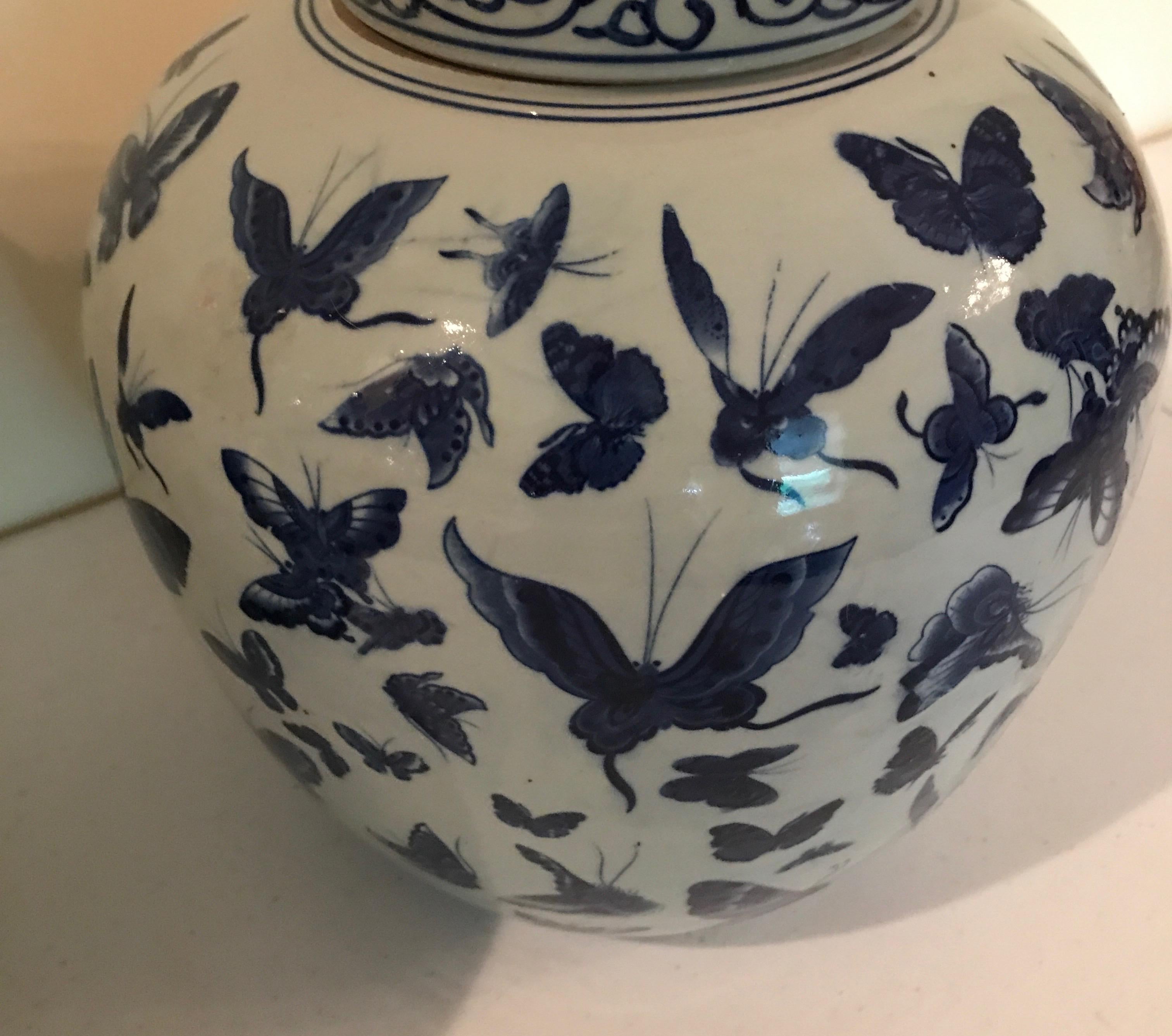 Porcelain Pair of Chinese Blue and White Butterfly Ginger Jars