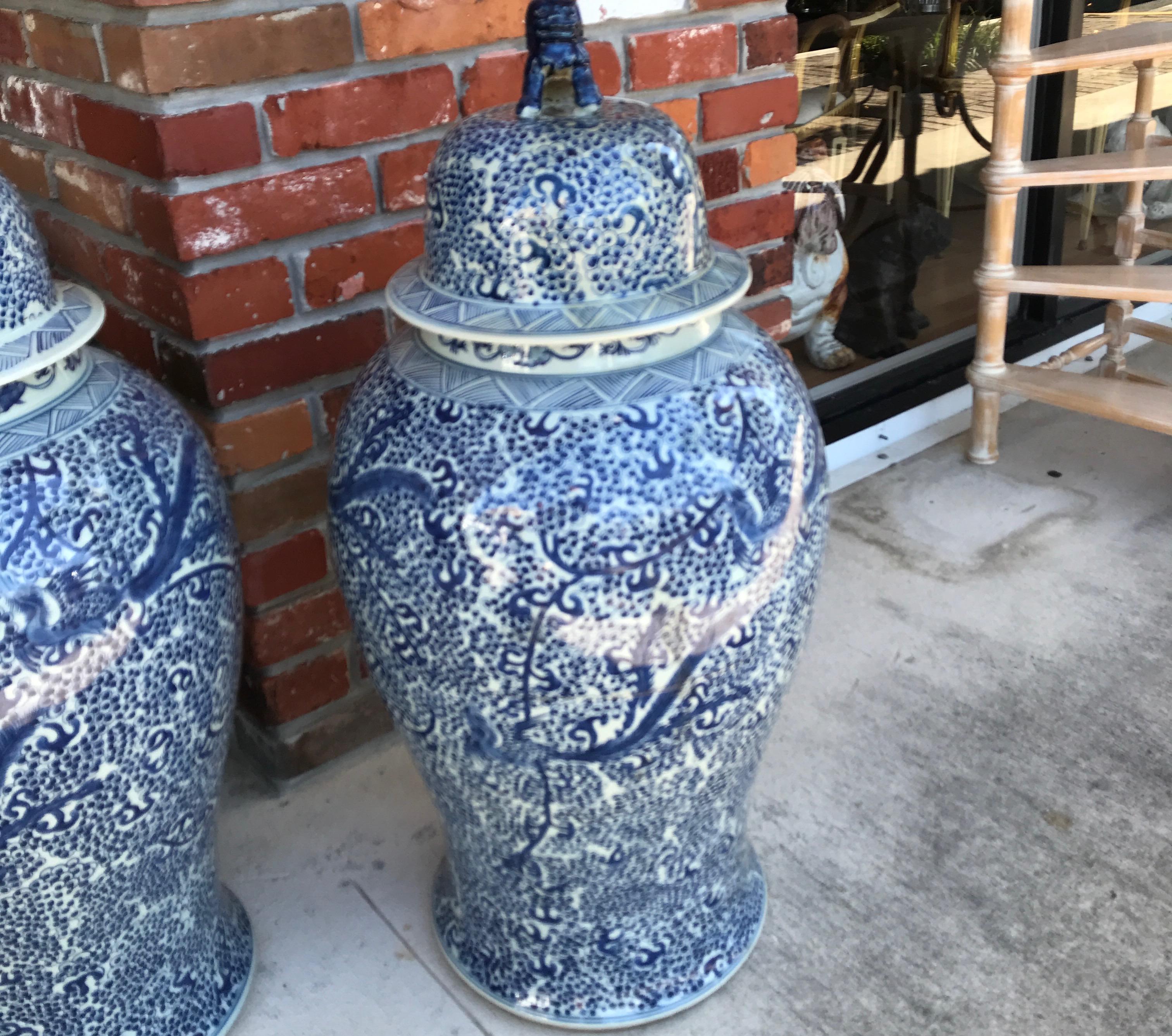 Pair of Chinese Blue and White Foo Dog topped Ginger Jars In Good Condition In West Palm Beach, FL