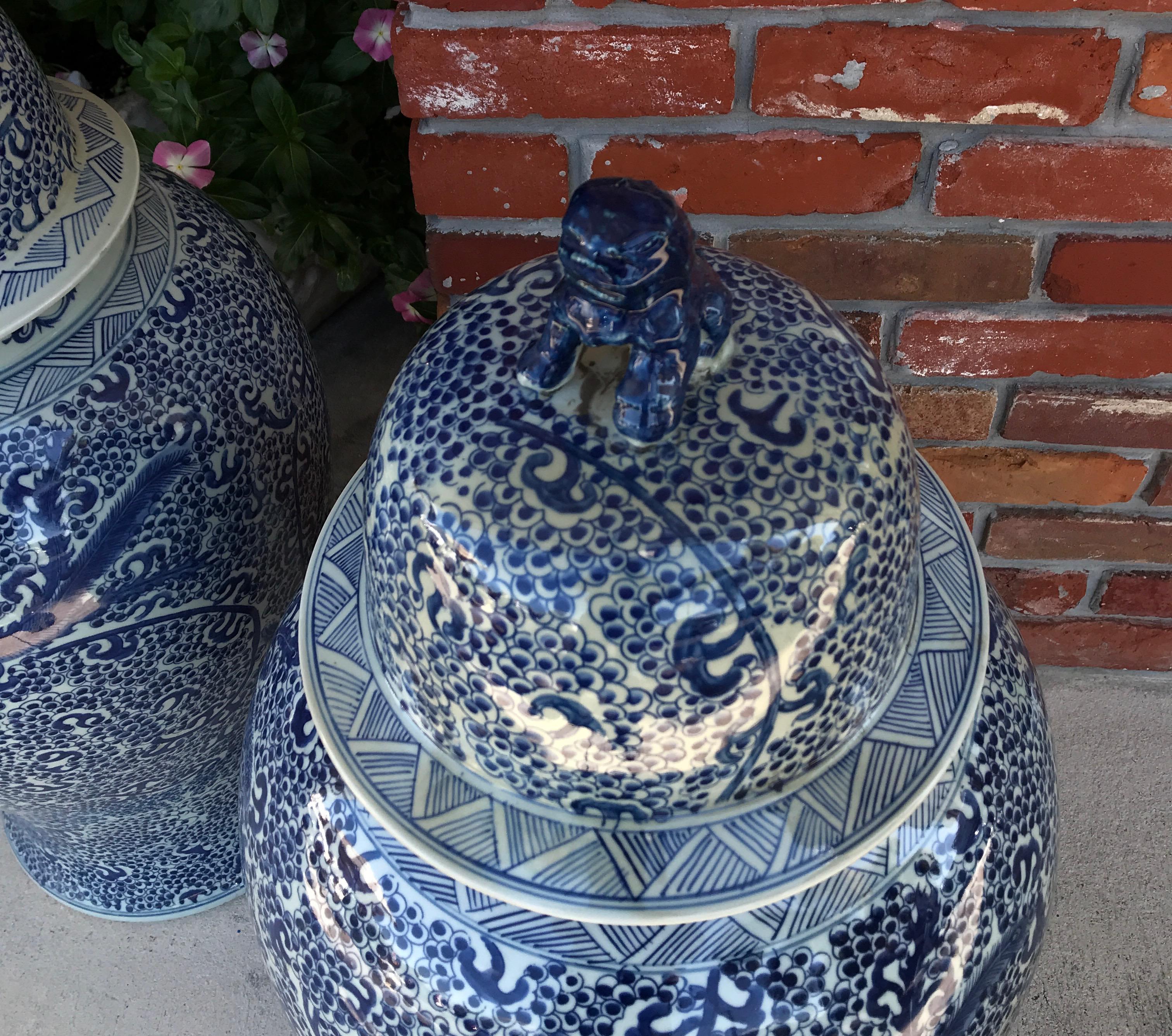 20th Century Pair of Chinese Blue and White Foo Dog topped Ginger Jars