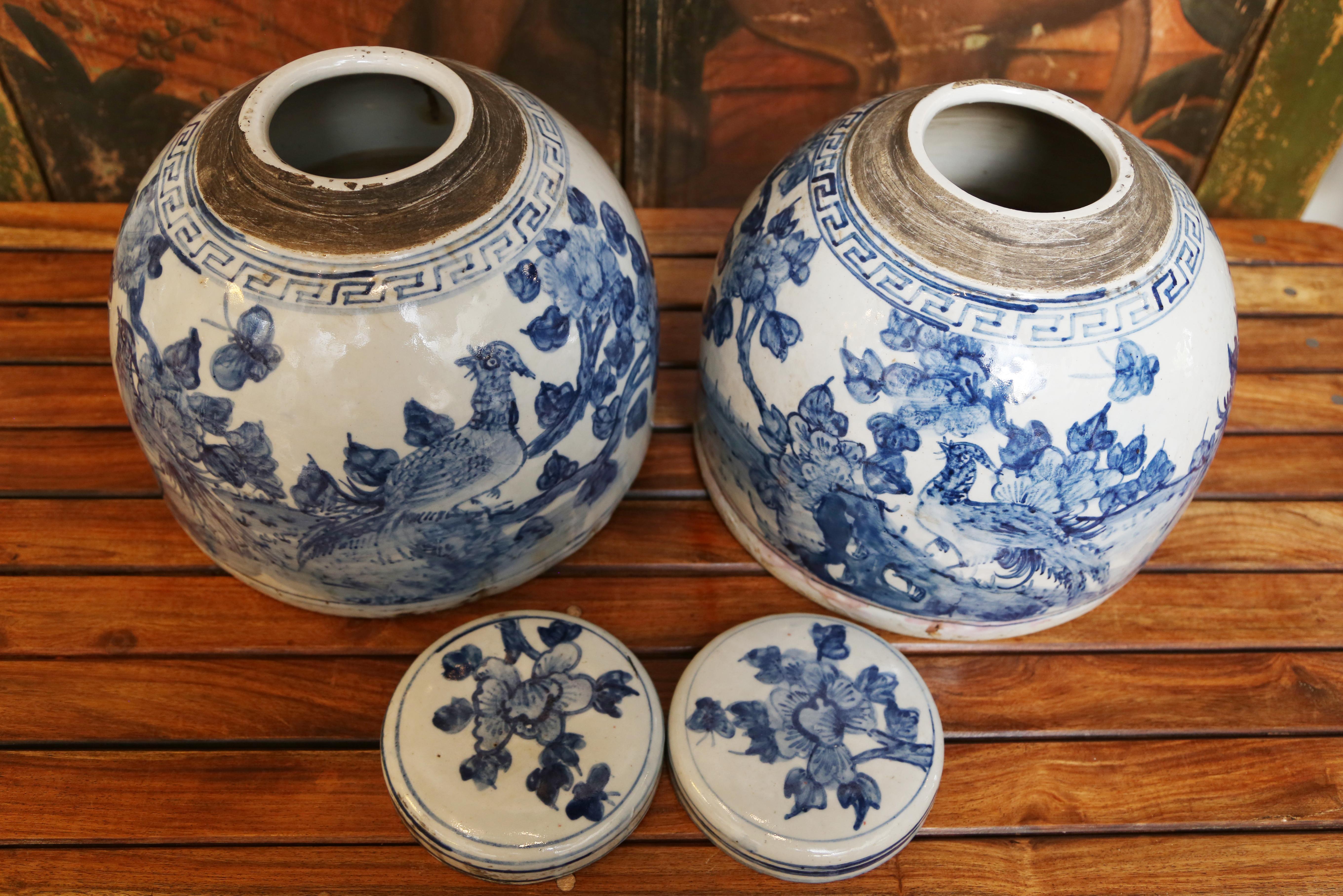 Unusually shaped Chinese blue and white ginger jars with lids.