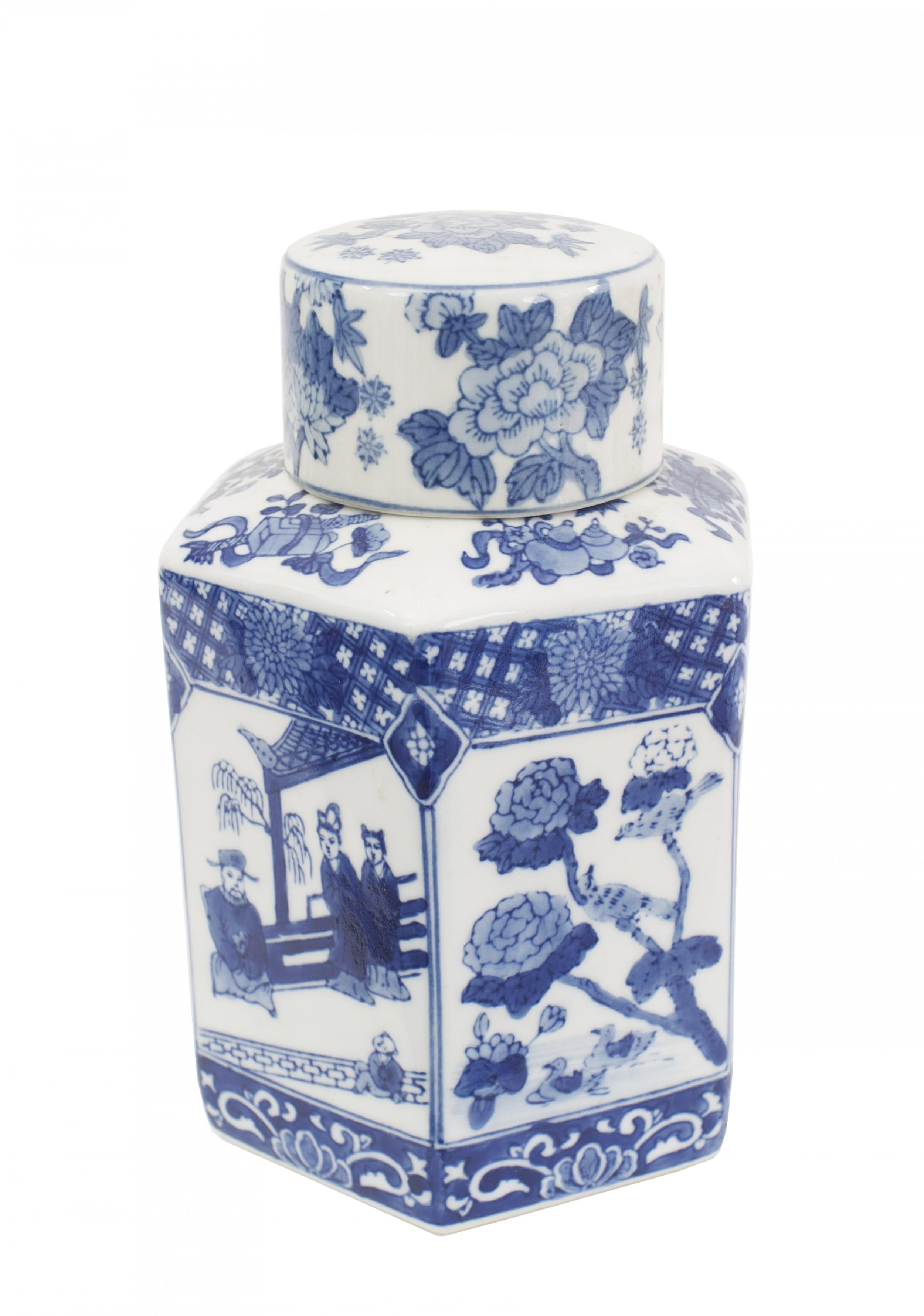 PAIR of Asian Chinese (20th Century) blue and white porcelain temple / ginger jars with round lids, and hexagonal bases, featuring figures and a floral pattern (PRICED AS PAIR)