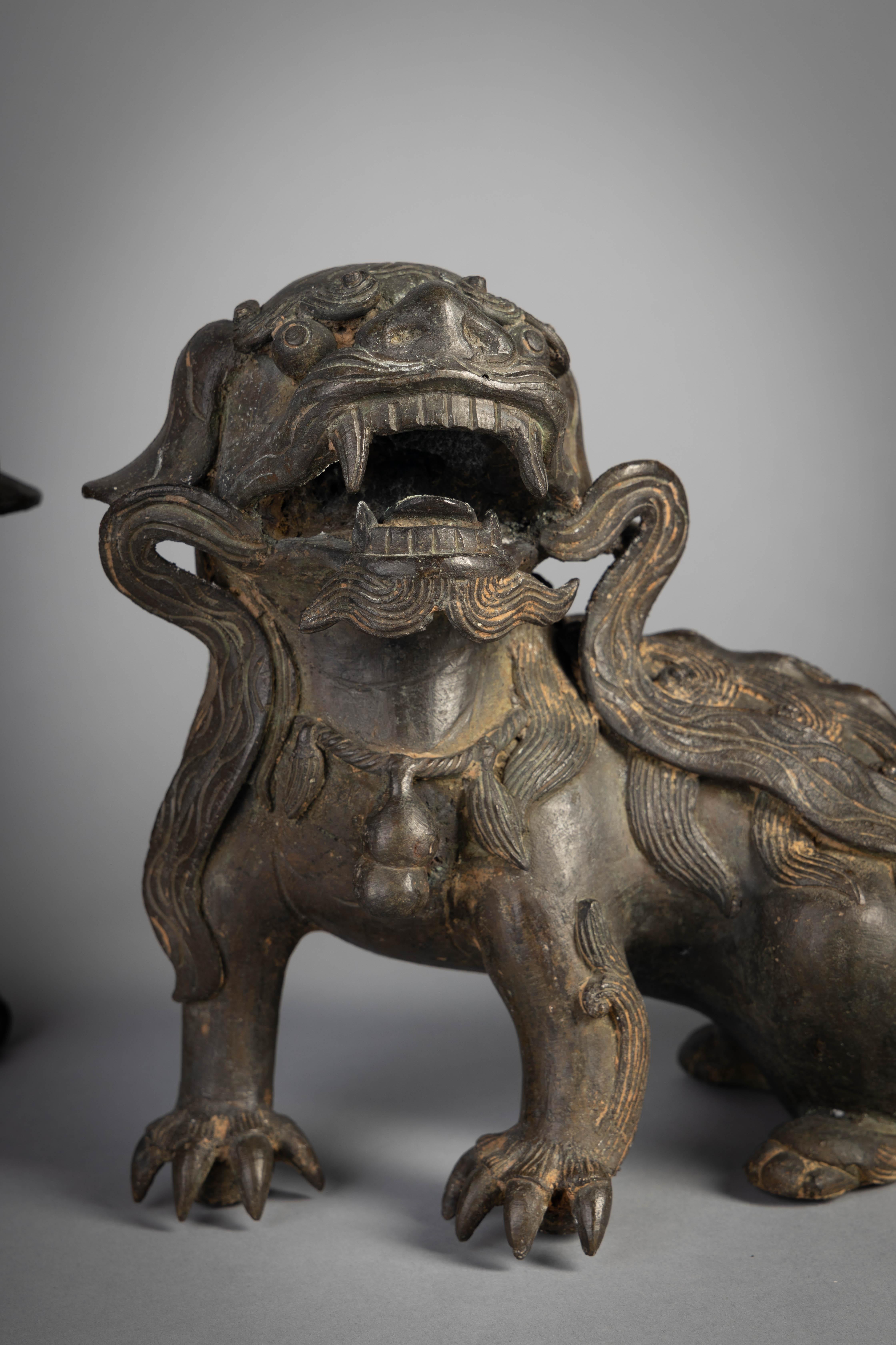 Pair of Chinese bronze Foo dogs, 19th century.