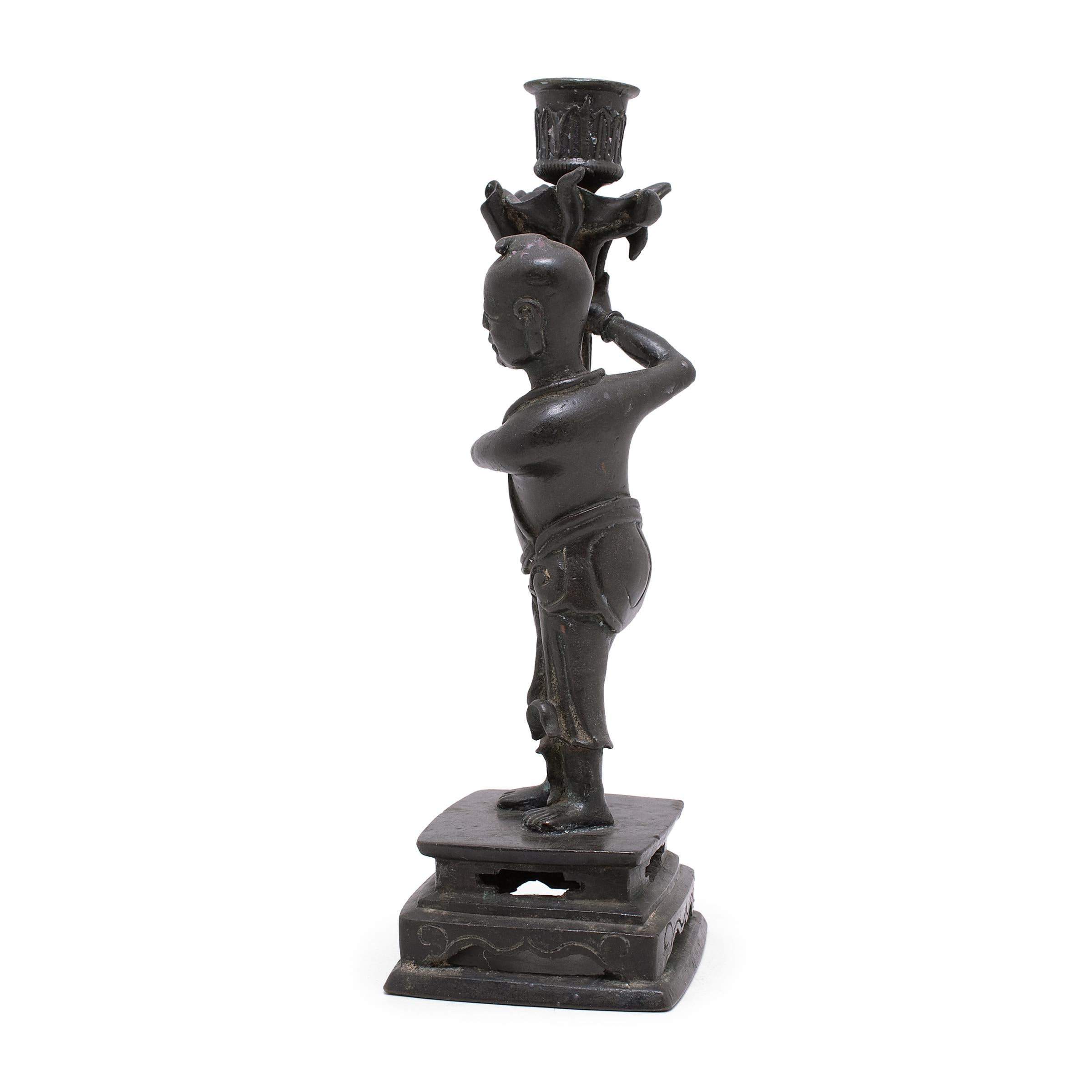 Pair of Chinese Bronze Ho Ho Boy Candle Stands, C. 1900 In Good Condition For Sale In Chicago, IL