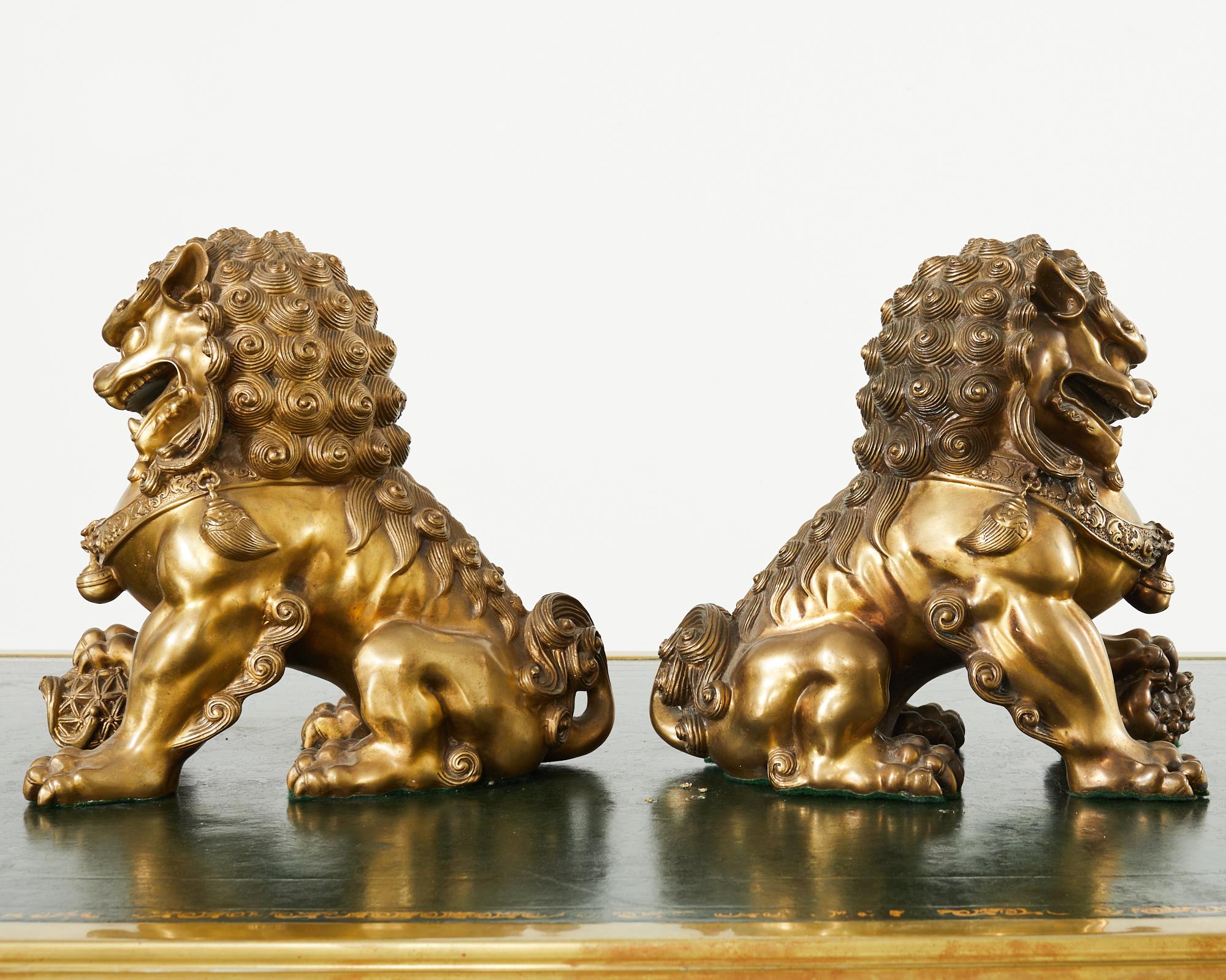 20th Century Pair of Chinese Bronzed Metal Buddhist Temple Foo Dogs Lions  For Sale