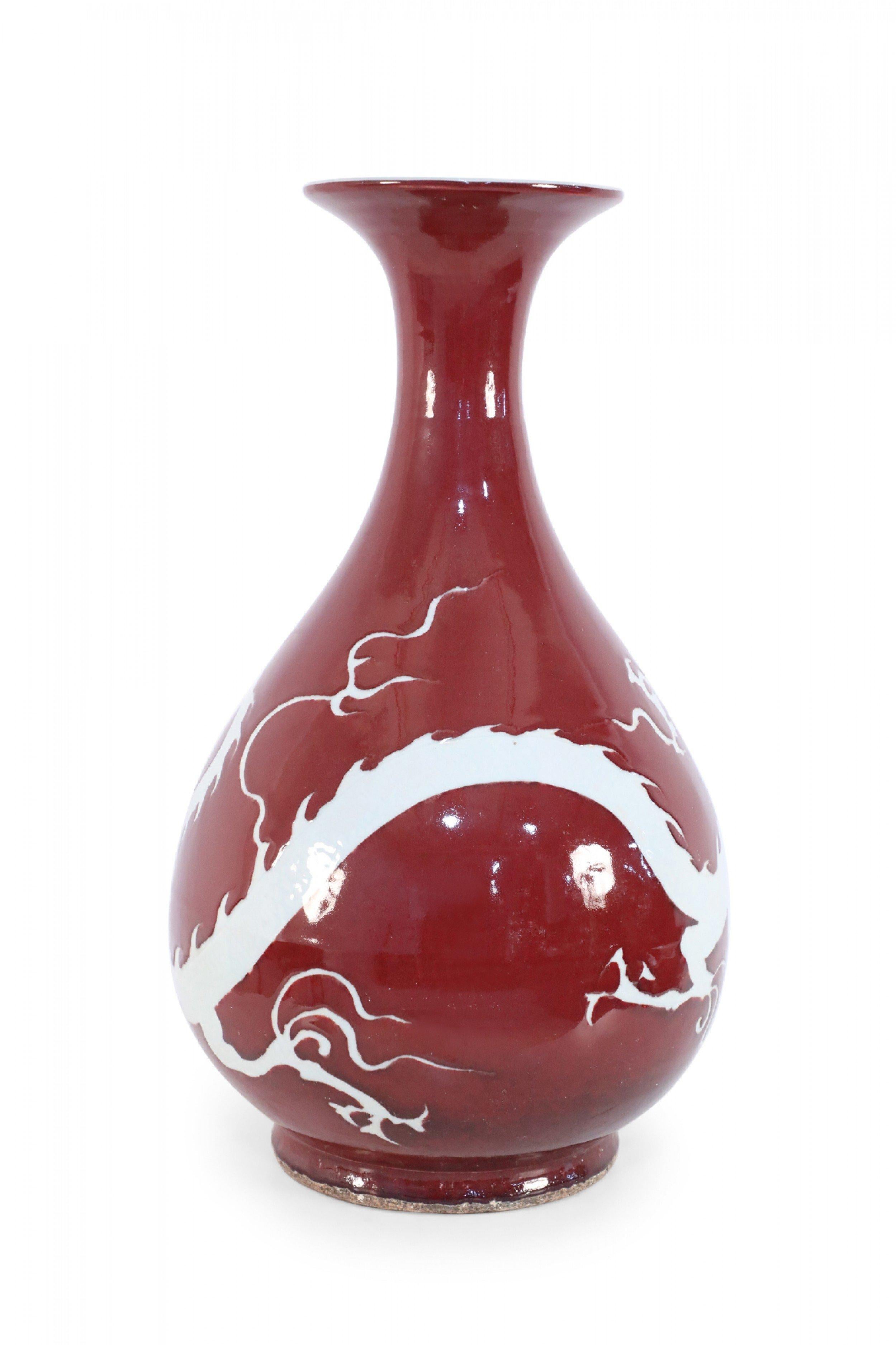 Pair of Chinese Burgundy and White Dragon Motif Vases In Good Condition In New York, NY