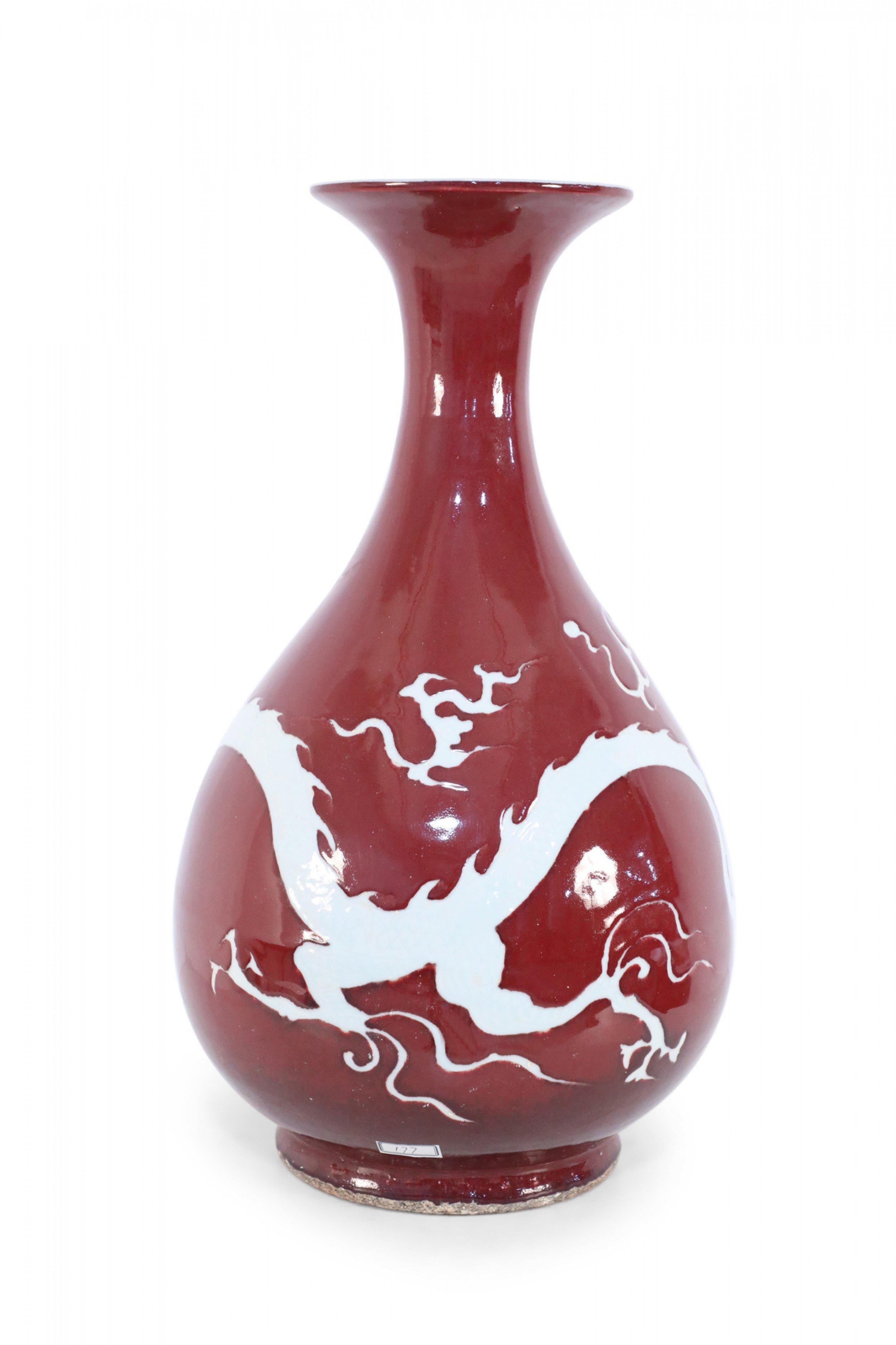 20th Century Pair of Chinese Burgundy and White Dragon Motif Vases