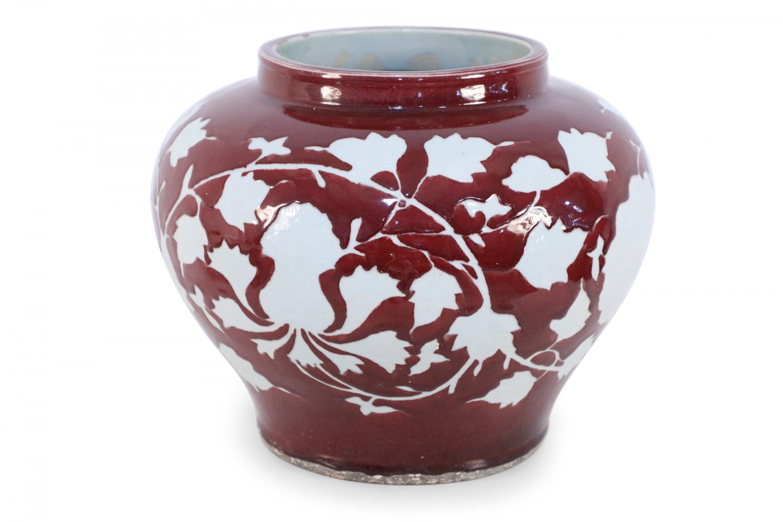 Porcelain Pair of Chinese Burgundy and White Floral Motif Pots For Sale