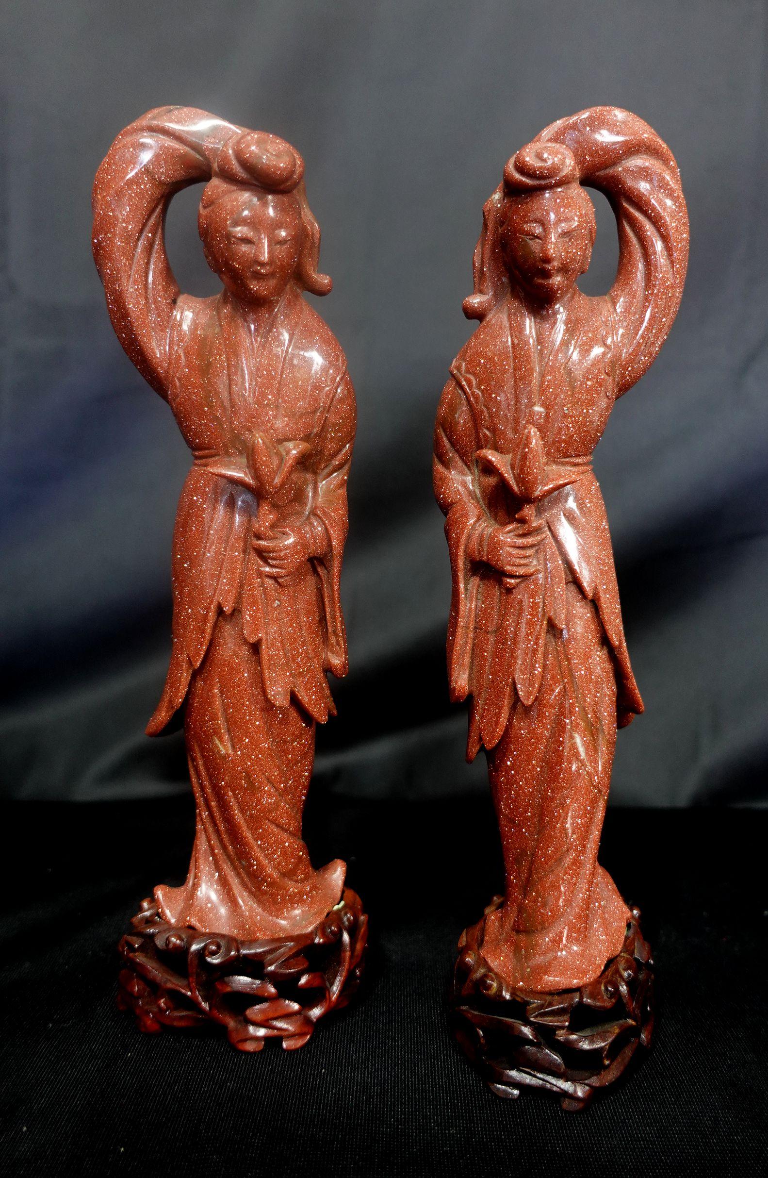 Antique Pair of Chinese Carved Aventurine Quanyin Figures 
Standing in flowing robes and holding a lotus blossom.
Dimensions
Heights 9