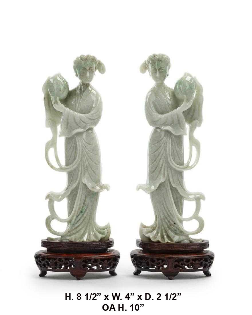 Opposing pair Chinese beautifully carved jade maidens on carved wooden stands.

Jade dimensions: H. 8 1/2