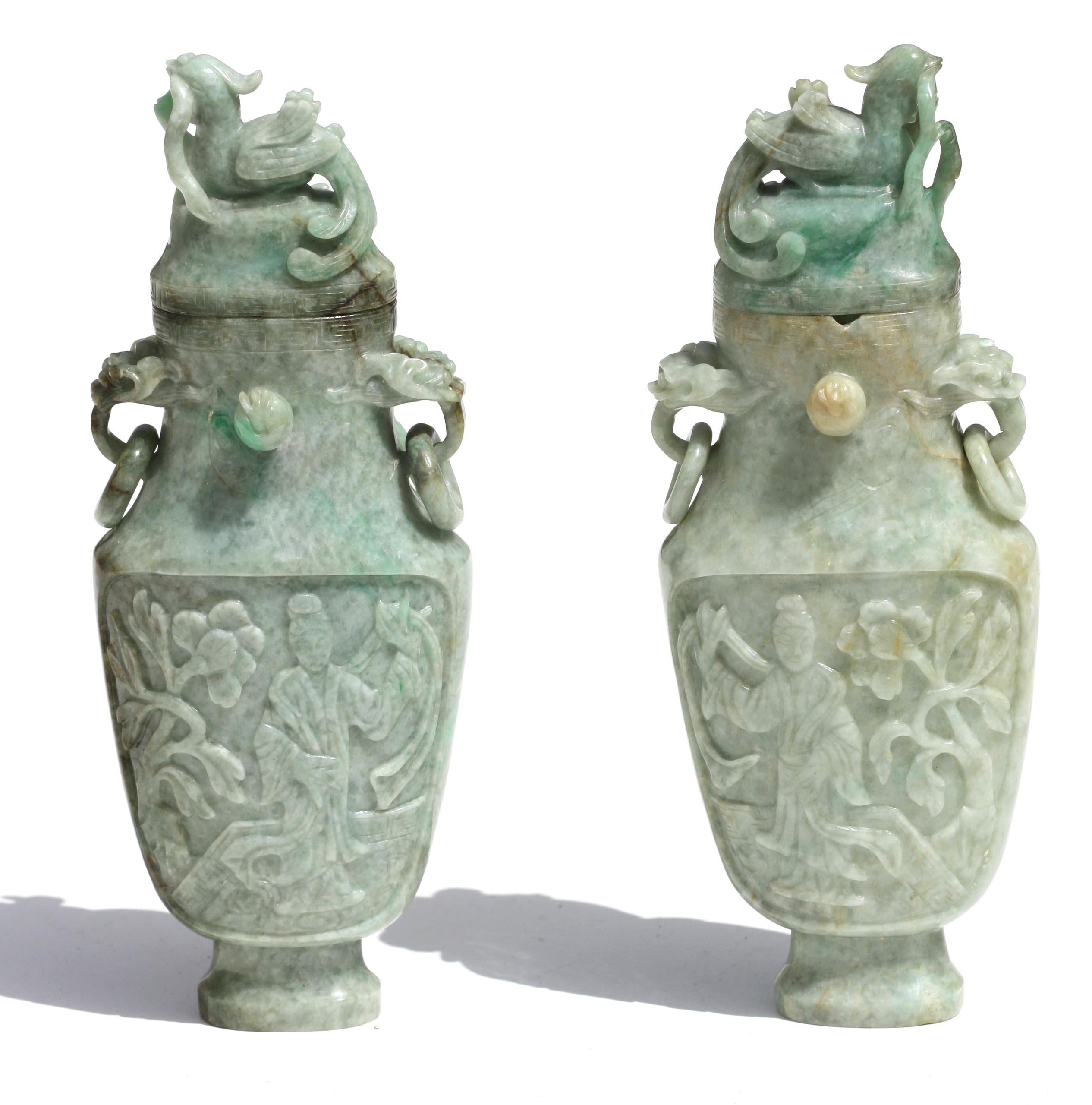 Pair of Chinese carved Jadeite Archaistic vases and covers
Each of bottle form, reserved with beauties and flowers, below a kylinin relief, flanked by beast handles, suspending loose rings, the cover surmounted by a mythological figure.
Measure: