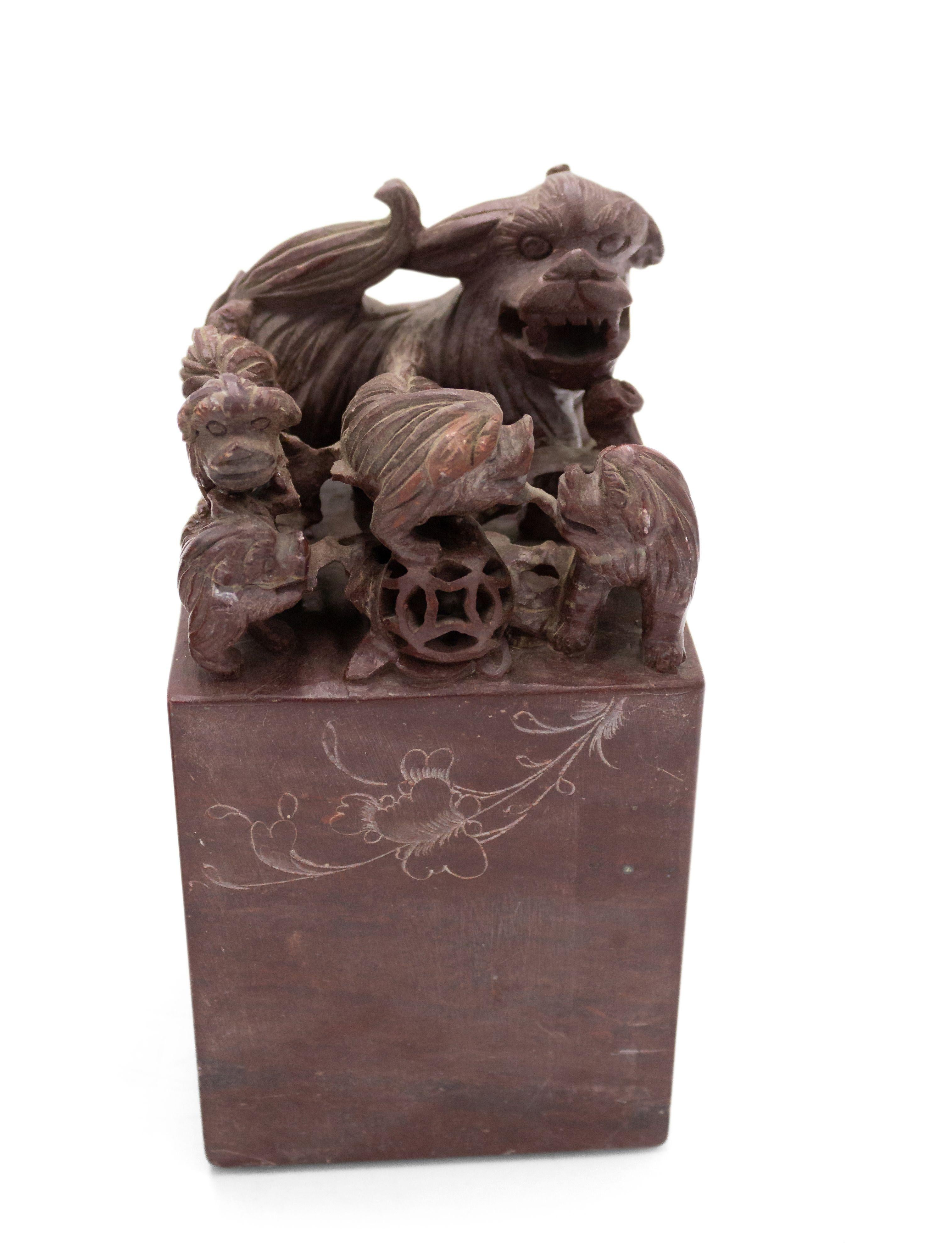 Pair of Asian Chinese-style (19/20th Century) carved brown stone bookends depicting a group of dogs over a lightly engraved base. (PRICED AS PAIR).
