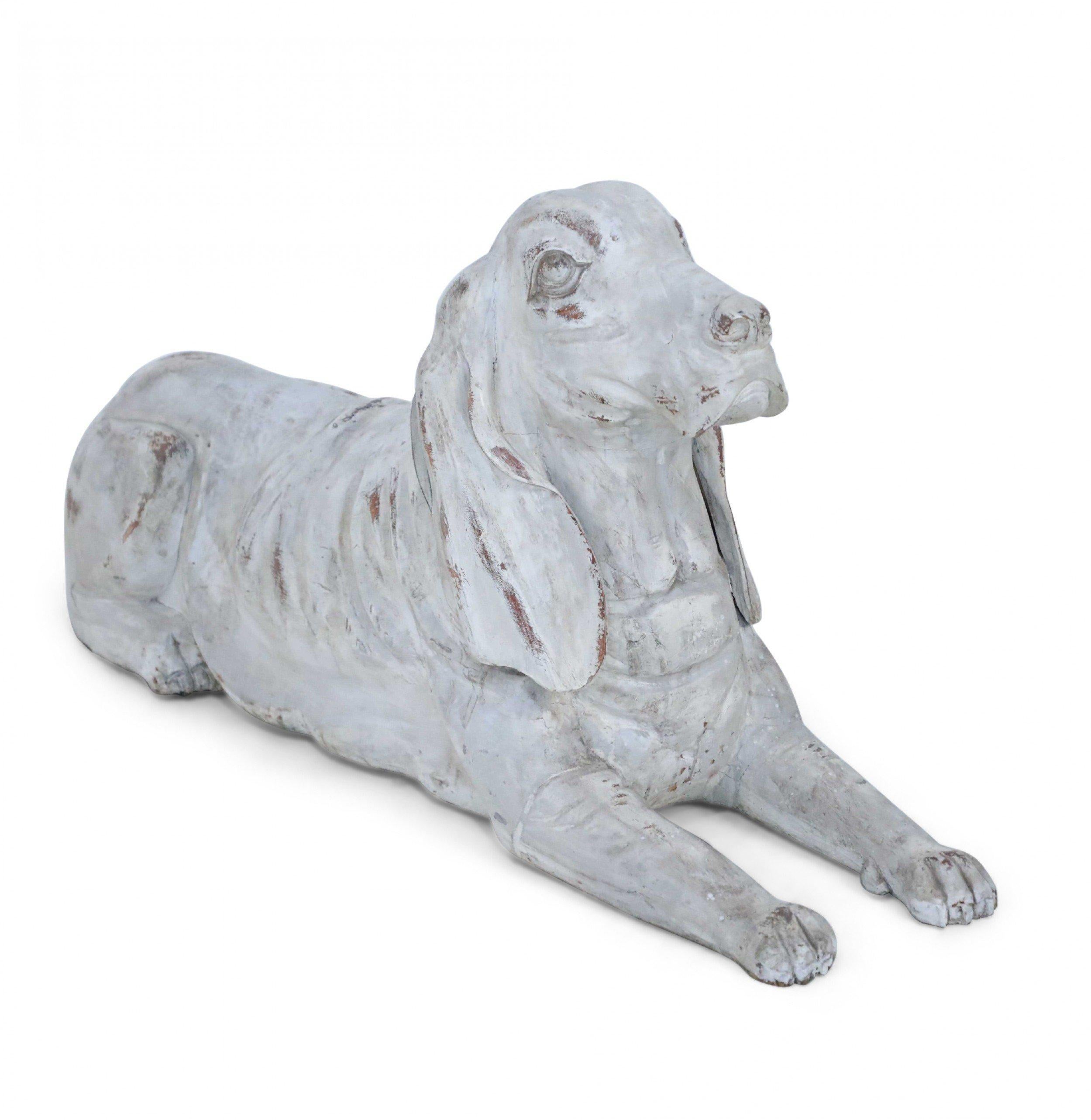 PAIR of Chinese carved wooden reclining dogs painted with whitewash finishes (PRICED AS PAIR)(Similar statues: NWL2458, NWL2459)