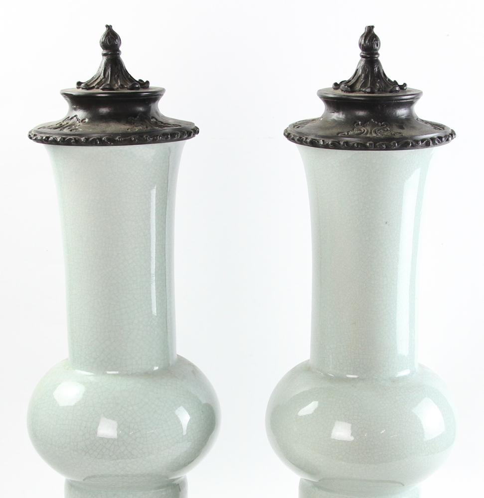 Pair of Chinese gu form celadon vases with metal covers and stands. Measuring 24