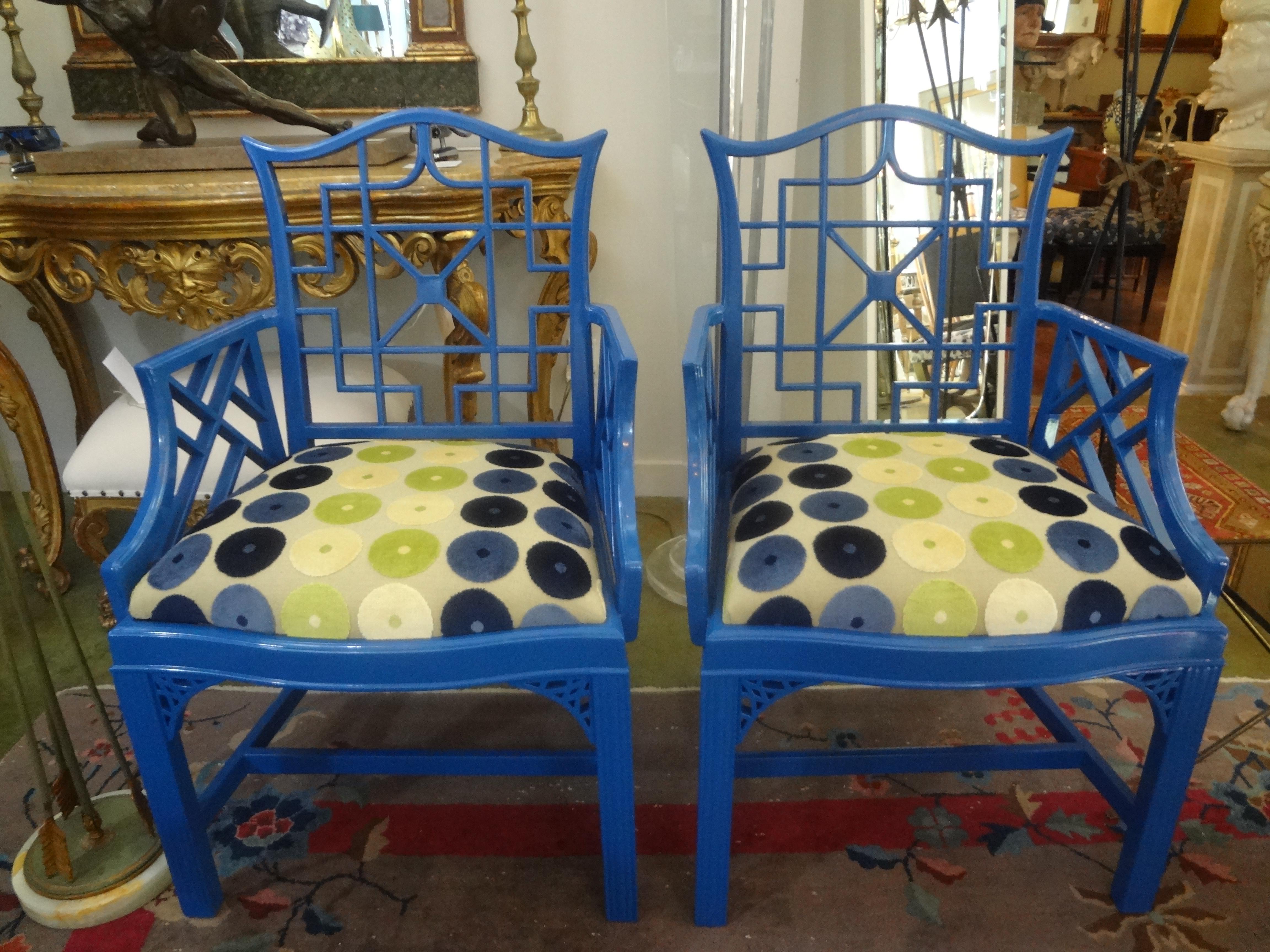 Pair of Chinese Chippendale style chairs.
Pair of Chinese Chippendale style chairs in a gorgeous blue high gloss finish. This pair has beautiful detailing and have been newly upholstered in a beautiful geometric cut velvet fabric. These armchairs