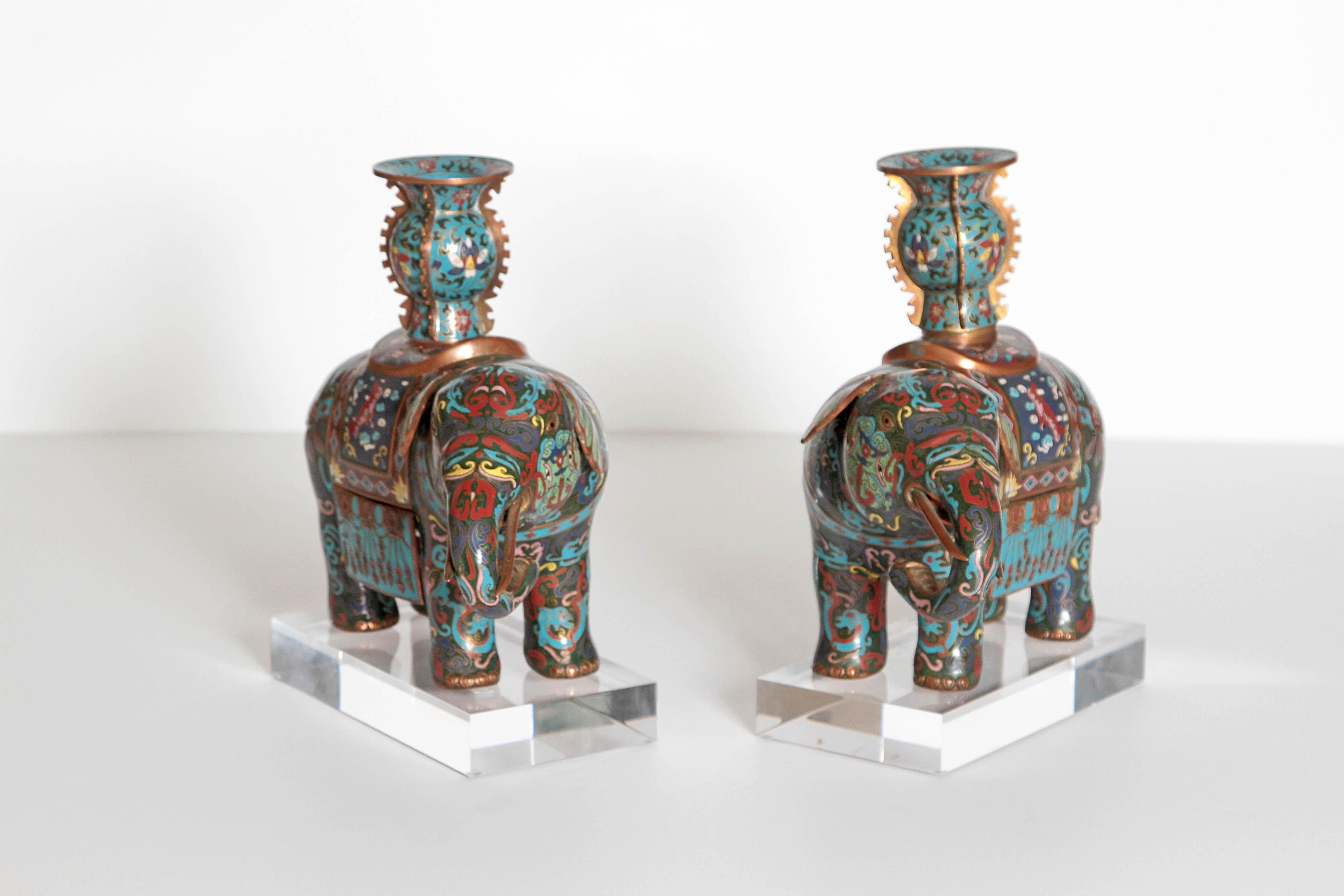 These delightful elephants are truly enchanting. They are multi-color with blue and green being the most prominent colors. They Stand 11 1/2