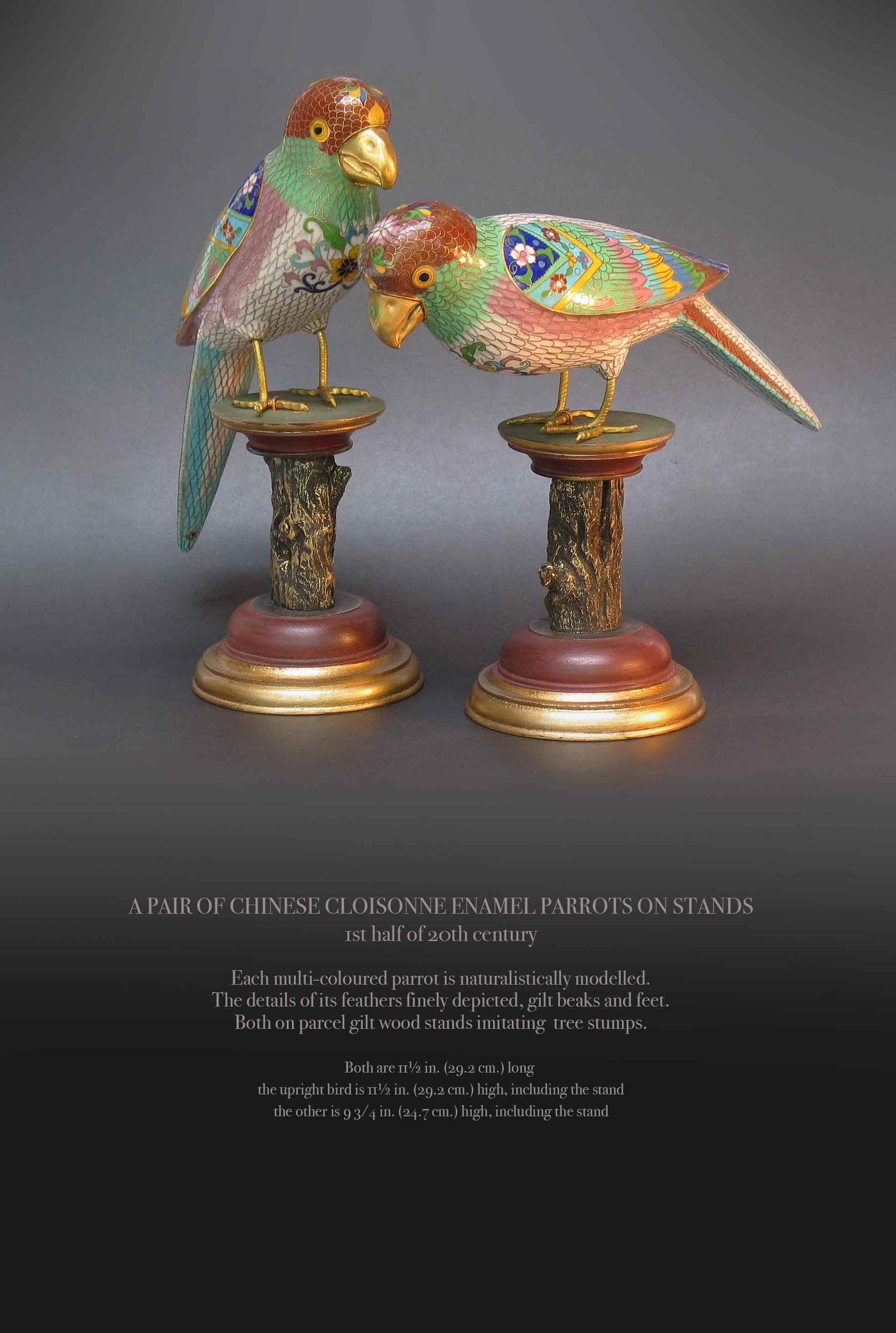 A PAIR OF CHINESE CLOISONNE ENAMEL PARROTS ON STANDS
1st half of 20th century

Each multi-coloured parrot is naturalistically modelled.
The details of its feathers finely depicted, gilt beaks and feet.
Both on parcel gilt wood stands imitating tree