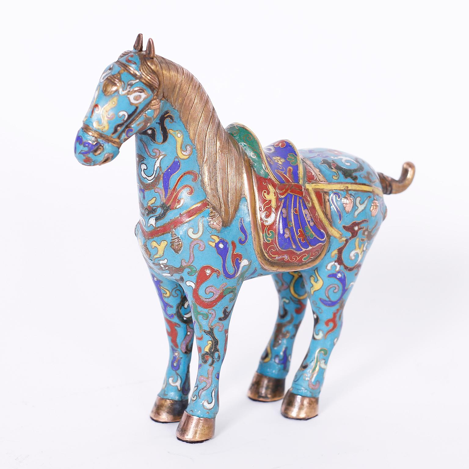 Pair of midcentury Chinese cloisonné or enamel on copper horses with colorful symbolic designs over a blue background with a strong reference to Tang dynasty.