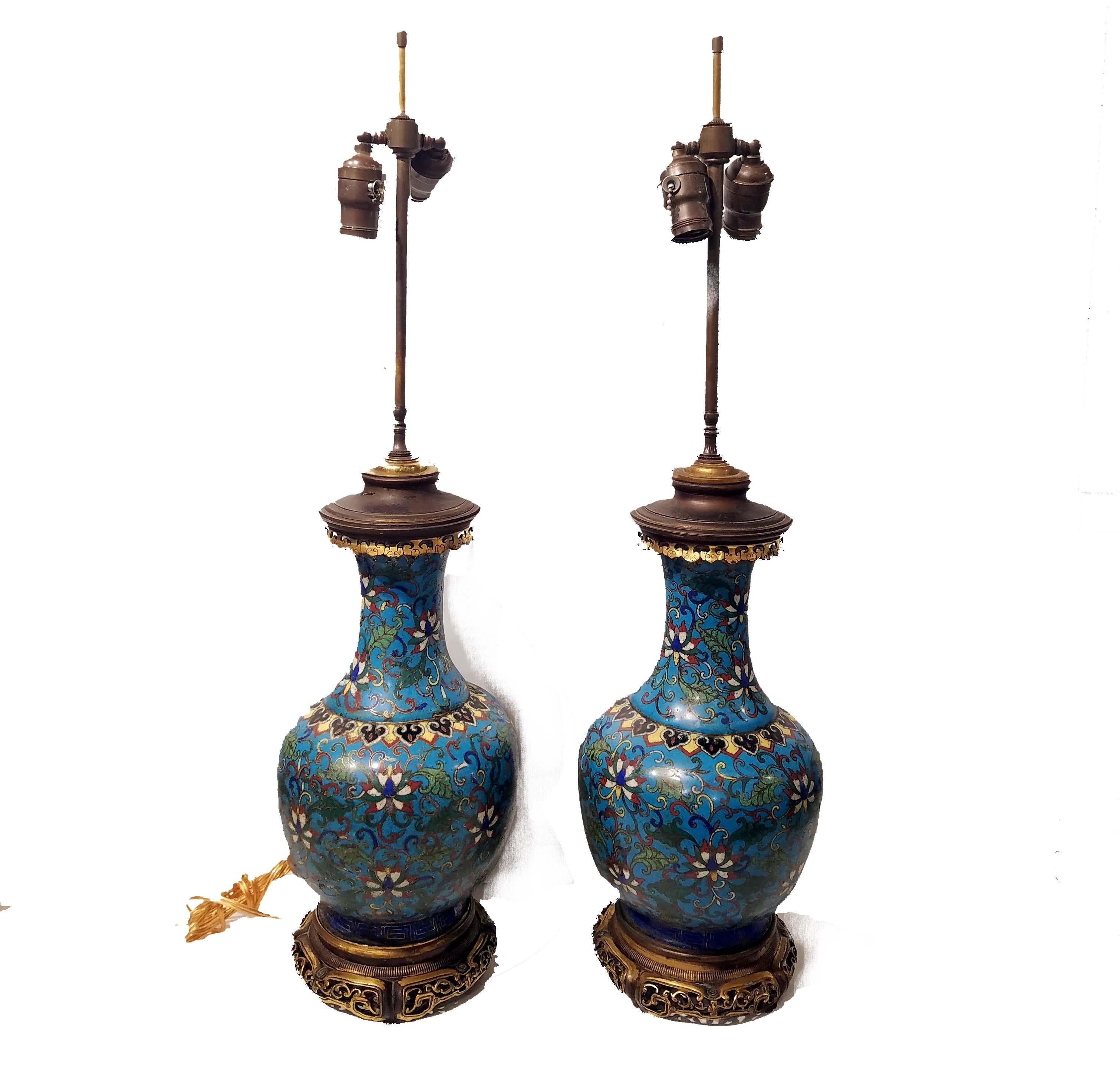 A beautiful pair of Chinese cloisonné vases, circa mid-1700s. Later mounted in French bronze mounts, made into oil lamps and again later electrified.
Ming decoration. The bronze mounts attributed to F. Barbedienne, circa 1880s.
Measures: Over all