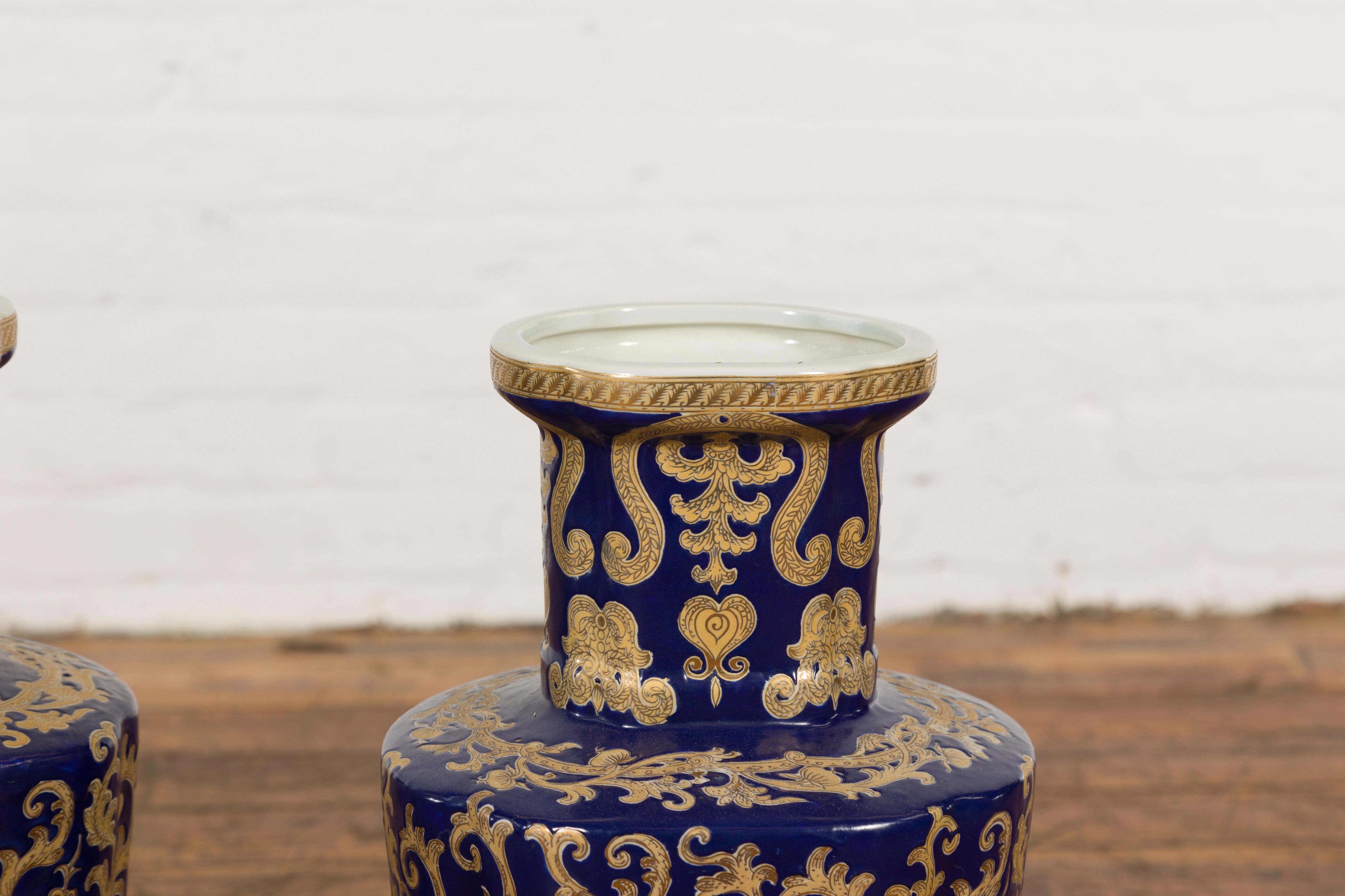 Chinese Pair of Dark Blue and Gold Vintage Vases with Intricate Design For Sale
