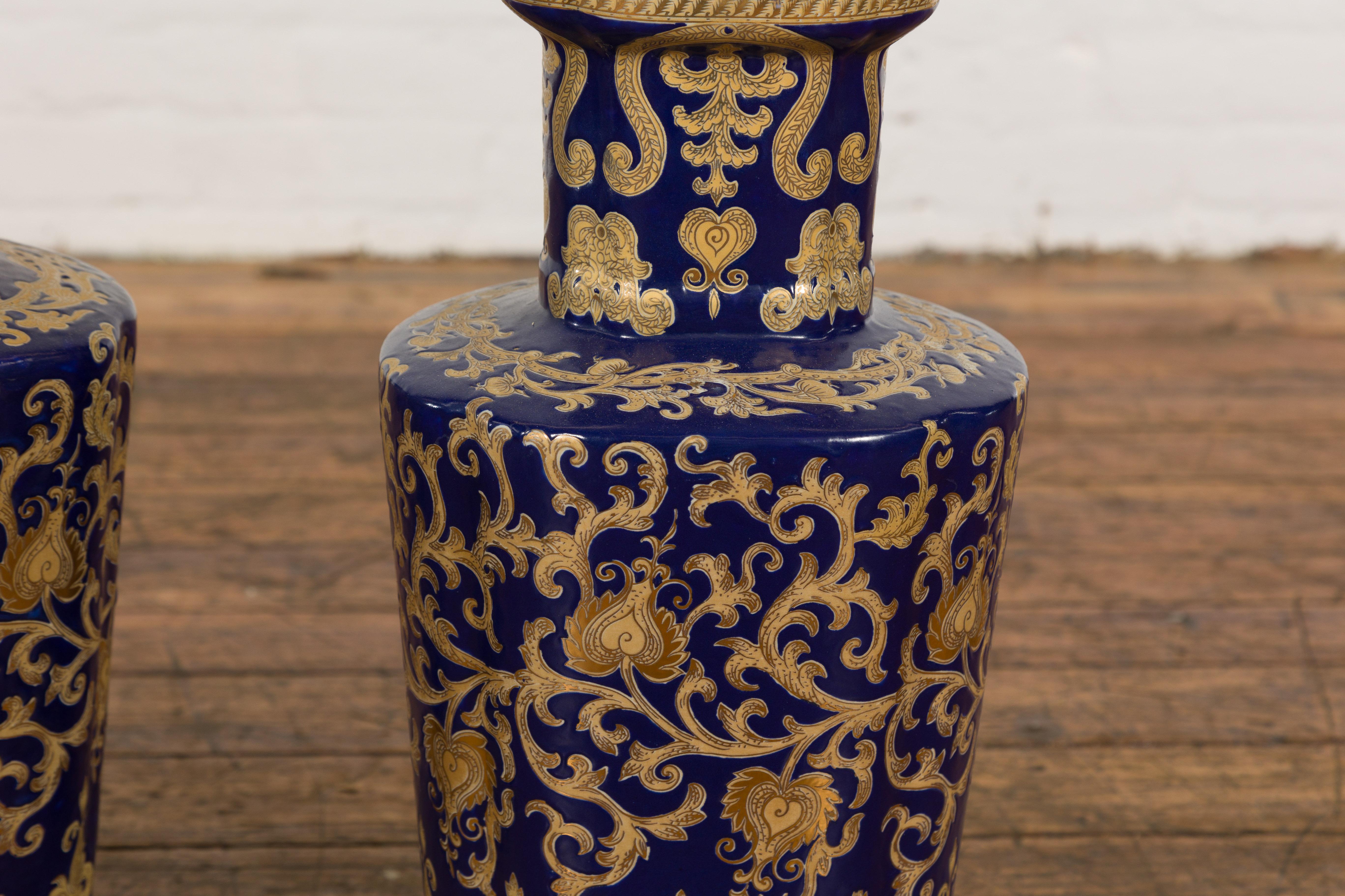 Porcelain Pair of Dark Blue and Gold Vintage Vases with Intricate Design For Sale