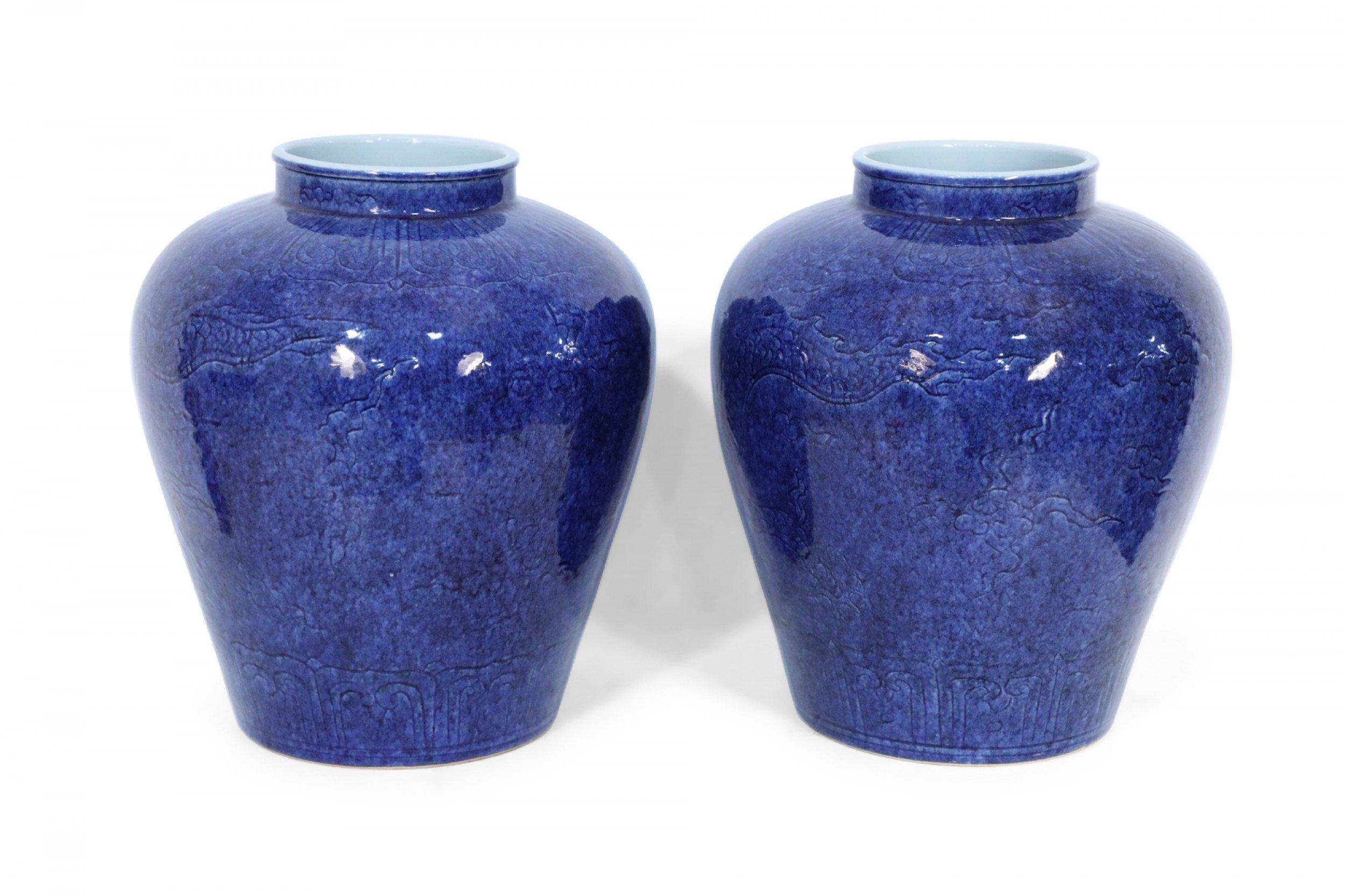 Porcelain Pair of Chinese Cobalt Blue and Incised Dragon Motif Vases
