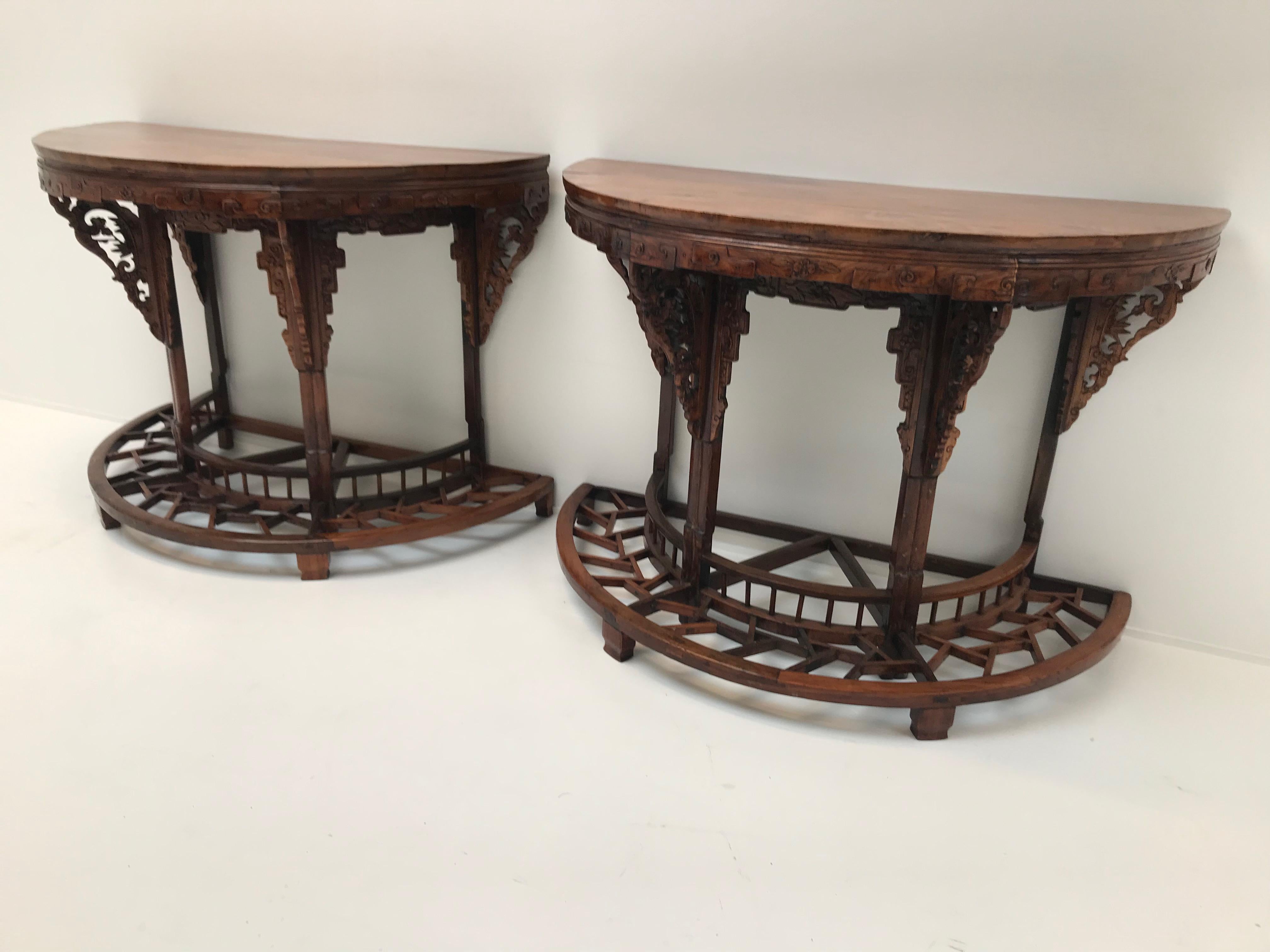 Exceptional pair of Chinese consoles in elmwood
Can also be combined as a round table
Very nice carved work
Nice as consoles but as well as a center table.
 