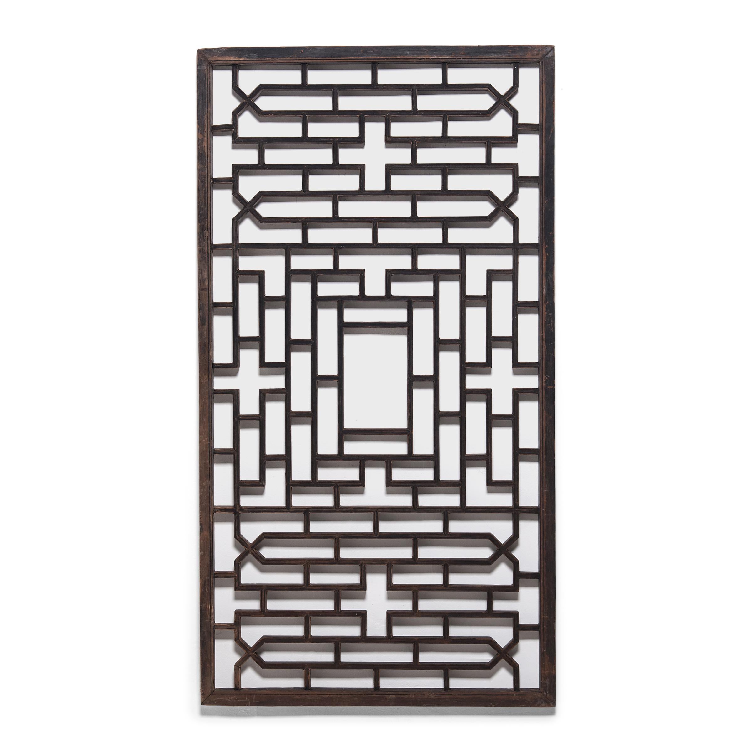 These early 20th century lattice window panels originated in Zhejiang province and once overlooked the interior courtyard of an aristocratic Chinese home. The geometric lattice pattern is linear and open, and was designed to allow light and fresh