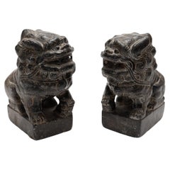 Pair of Chinese Dark Stone Fu Lions, c. 1800