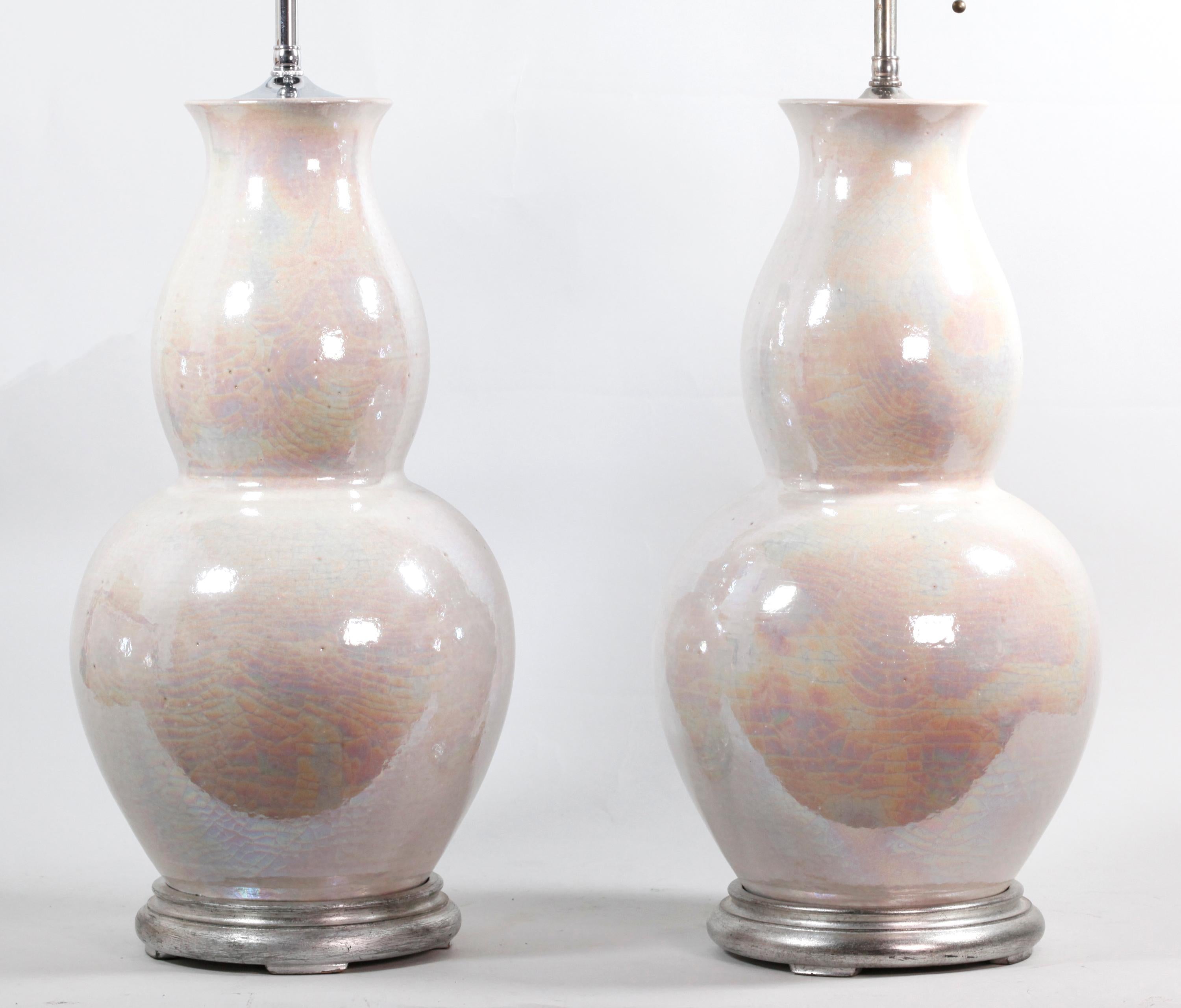 vases have been made into lamps; approximate measurements of each vase with wooden base: 18in(H) x 8in(diameter); overall approximate measurements of each vase with lighting components and wooden base: 30in(H)
