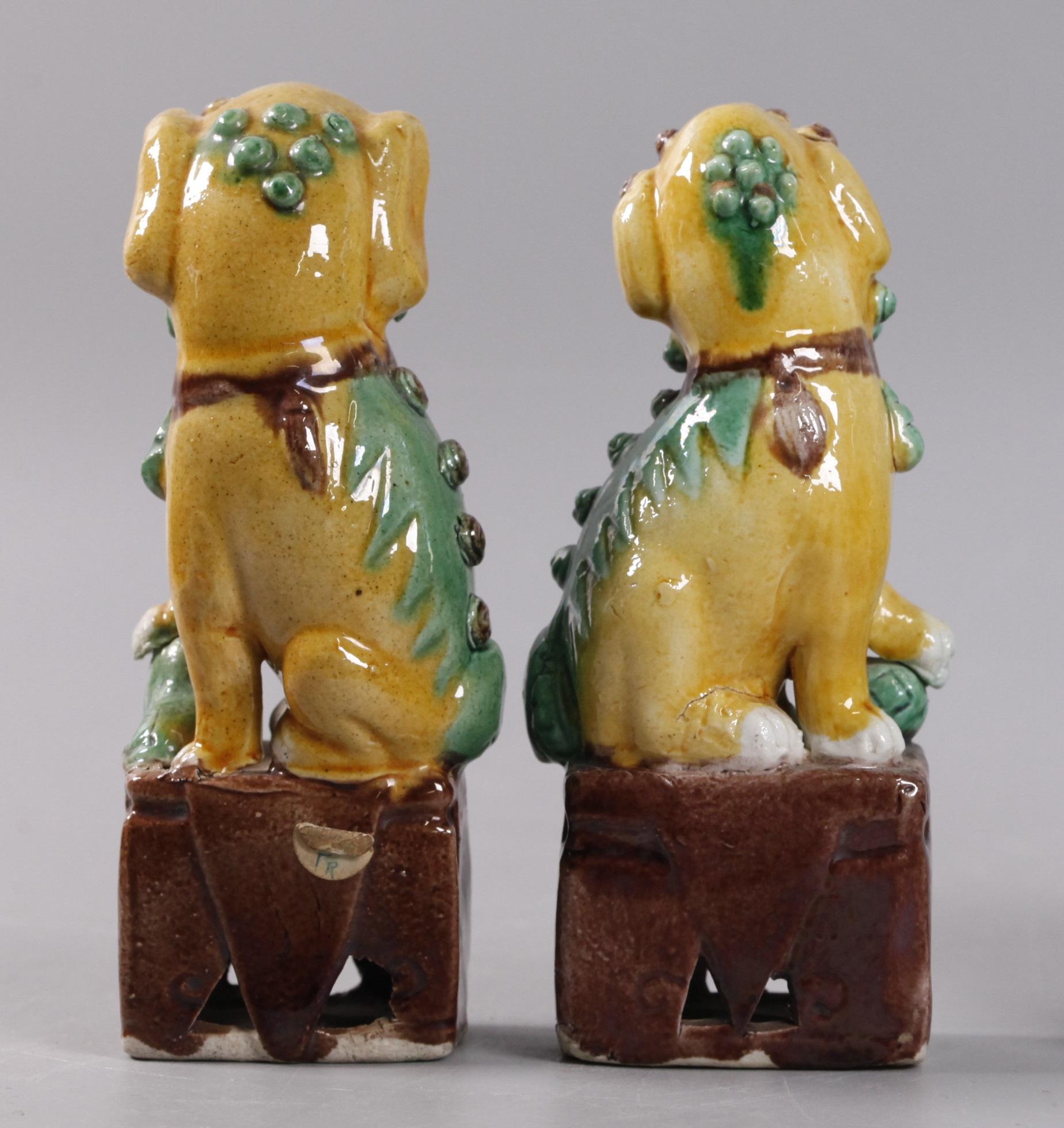pair of Chinese egg, spinach glazed foo lions/dogs, 19th c. In Good Condition For Sale In New York, NY