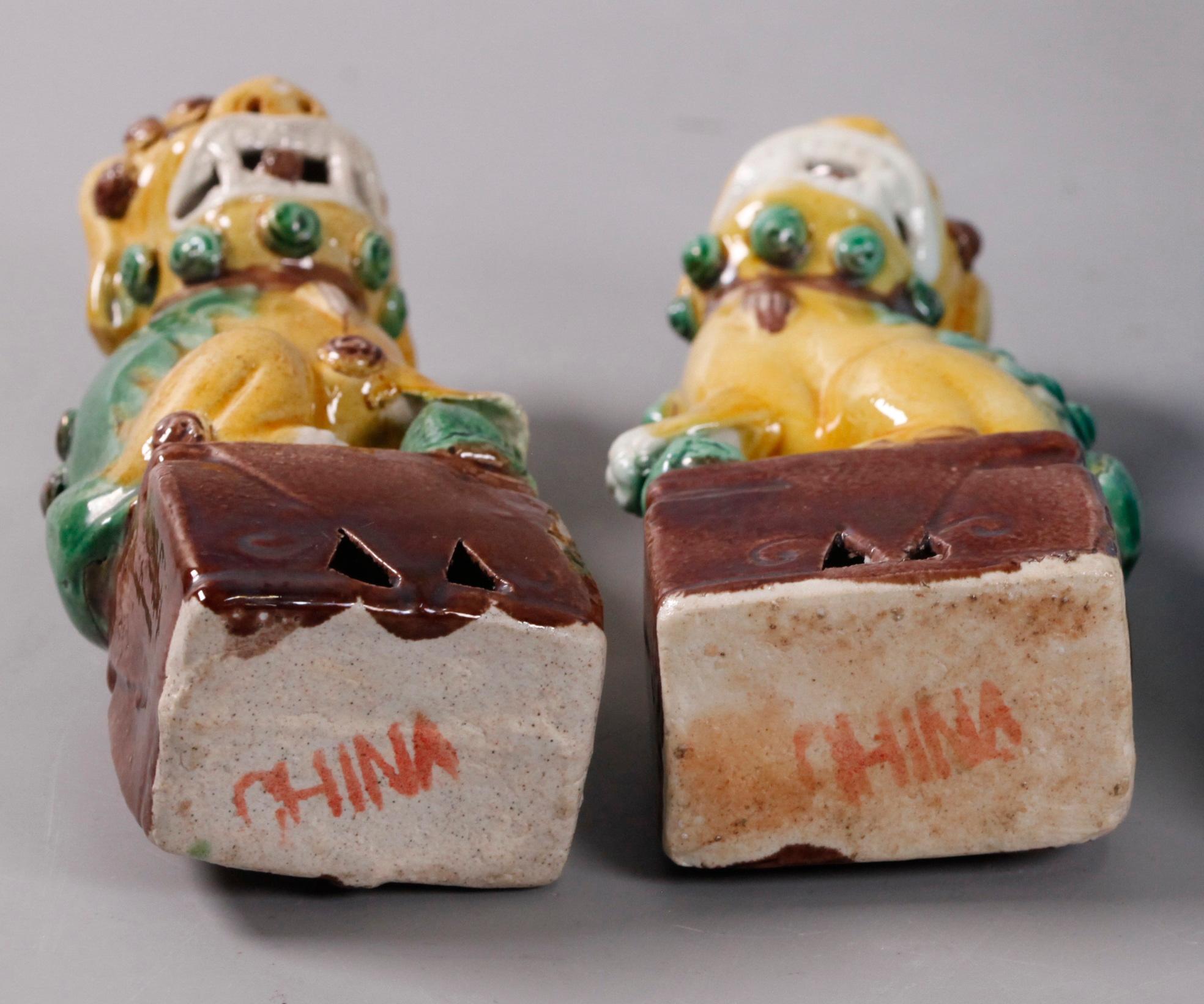 19th Century pair of Chinese egg, spinach glazed foo lions/dogs, 19th c. For Sale