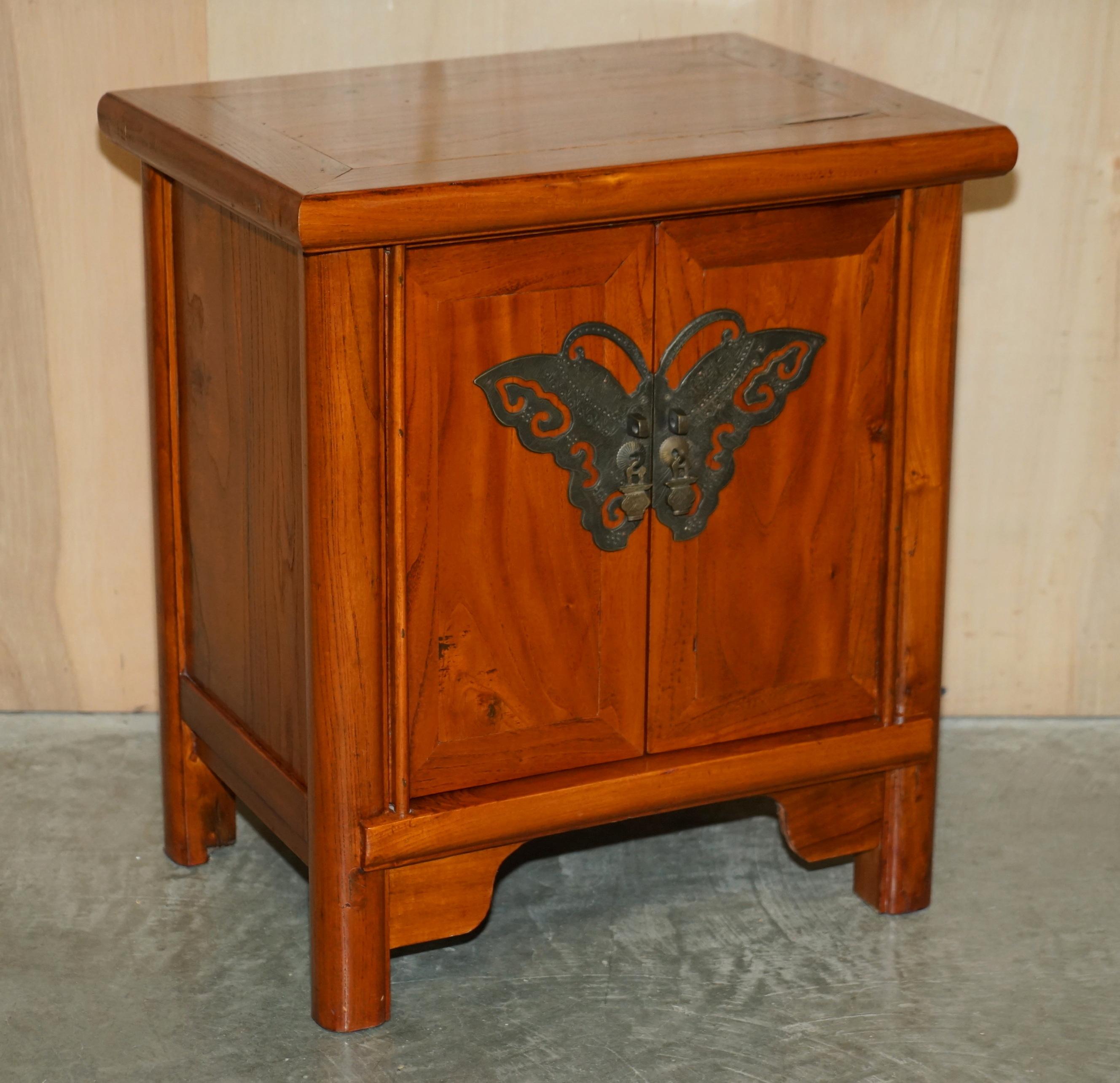 We are delighted to offer for sale this lovely pair of Chinese elm side table cabinets with oversized brass butterfly doors 

A very good looking well made and decorative pair, the finish is exquisite, they look expensive, important and