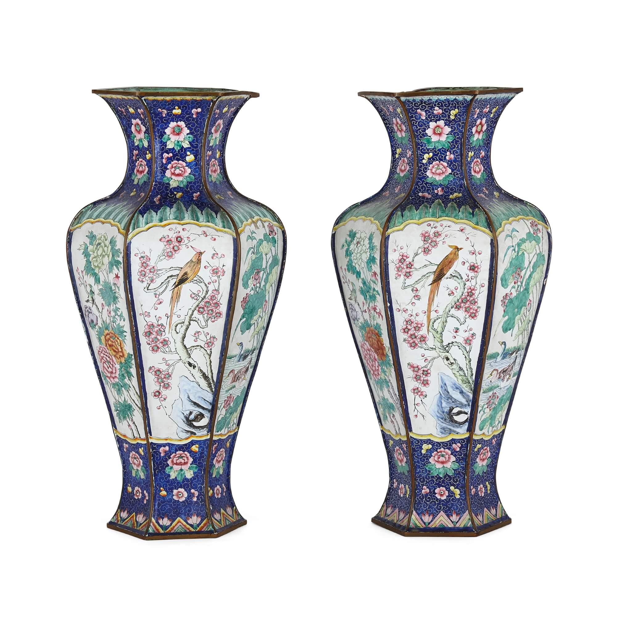 Pair of Chinese enamel vases
Chinese, 19th Century
Height 38cm, diameter 19cm

These charming Chinese vases are crafted from enamel. Each vase features a bulbous body with a flared foot and a waisted neck leading to a broad rim. The body of each is
