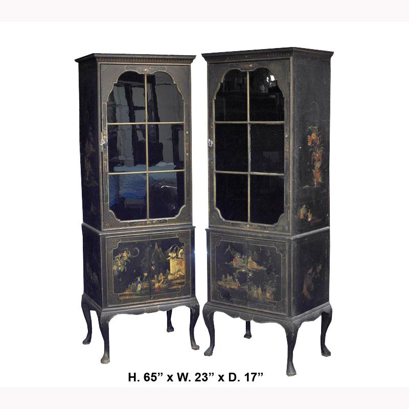 Apposing pair of Chinese Export black lacquer tall cabinet made for the English market, mid 20th century.
Each cabinet has top and bottom compartments with apposing doors revealing red lacquer interiors with shelves. the glass doors are painted
