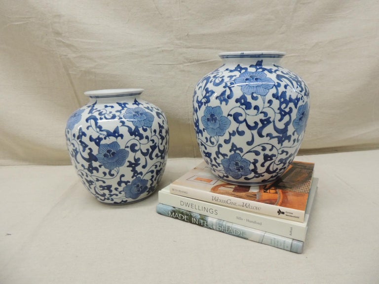Pair of Chinese export blue and white round ceramic vases
Floral pattern with white cobalt blue and sky blue tones
Bulbous shape, hand crafted
Size: 8 x 8.75