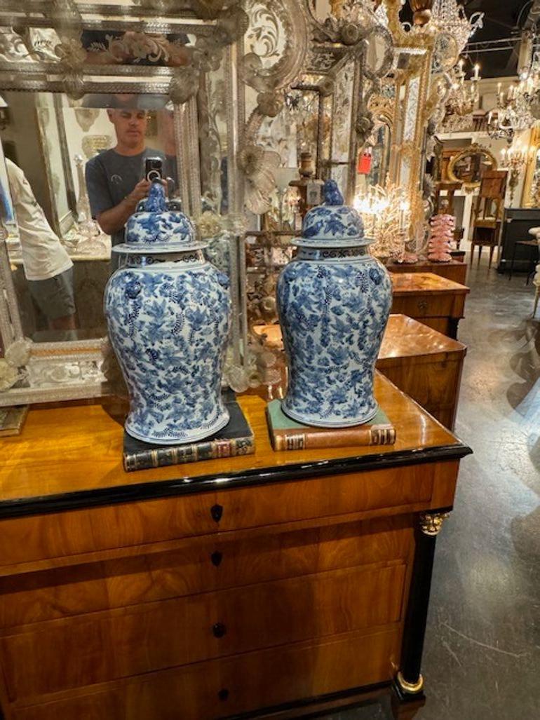 Beautiful pair of Chinese export blue and white Temple jars with a lovely floral pattern. A great accessory!!