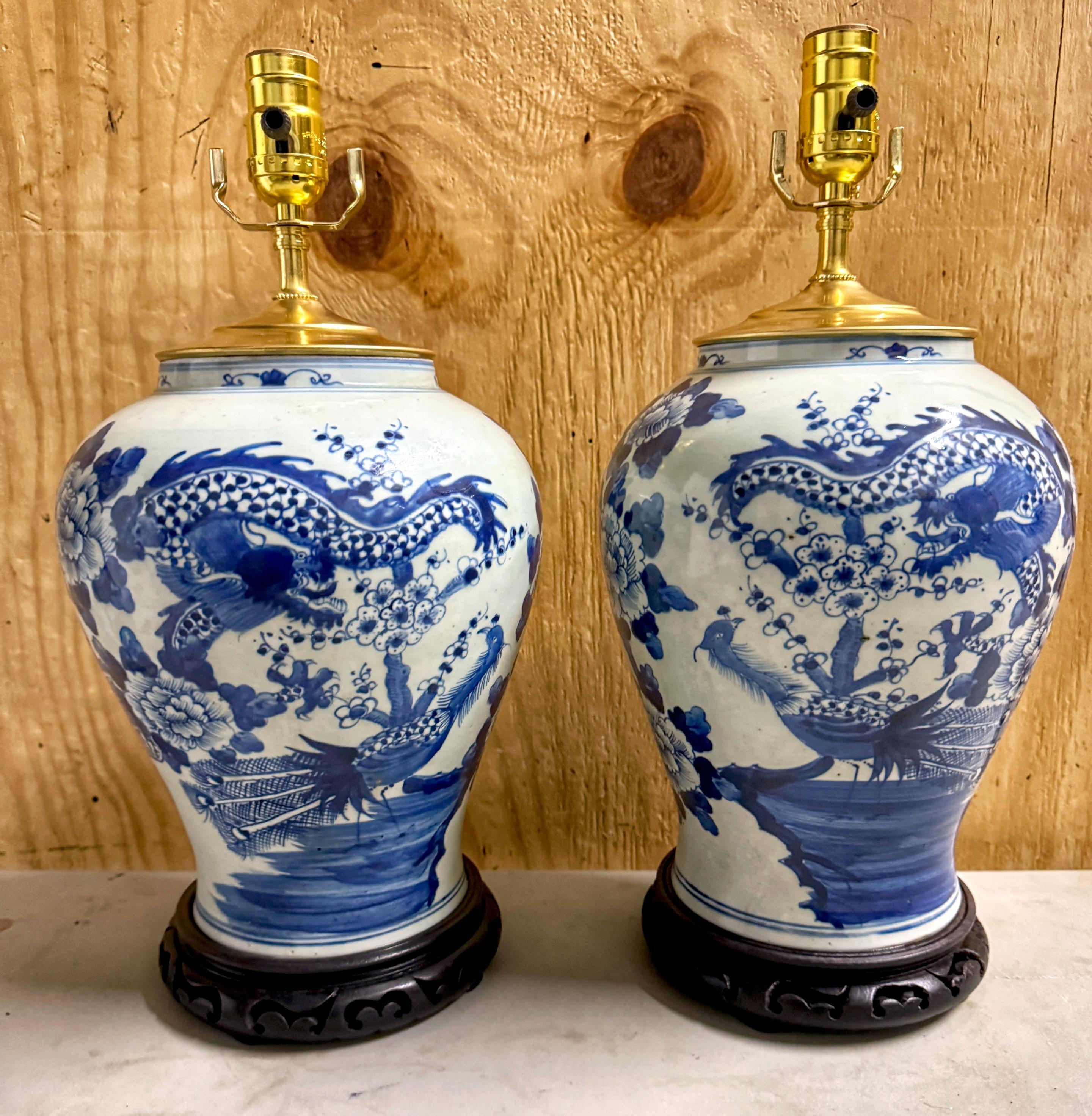 Pair 19th C. Chinese Blue & White 'Canton Dragon & Phoenix  Bird'  Motif Vases, Now as Lamps 
China, Late 19th Century , The lamping 20th Century

Illuminate your space with the rich cultural history embodied in this pair of 19th-century Chinese
