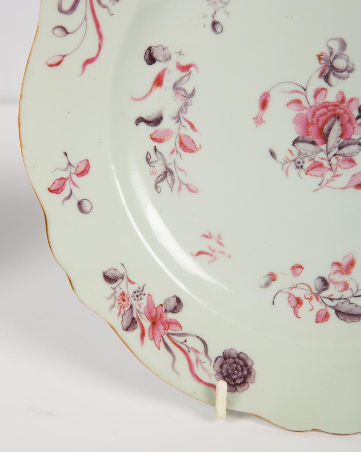 We are pleased to offer this pair of Chinese export Famille Rose dessert plates with sprays of delicately painted flowers in purple and pink surrounding a bouquet of tulips and peonies similarly painted at the centre of the dish.
These lovely dishes