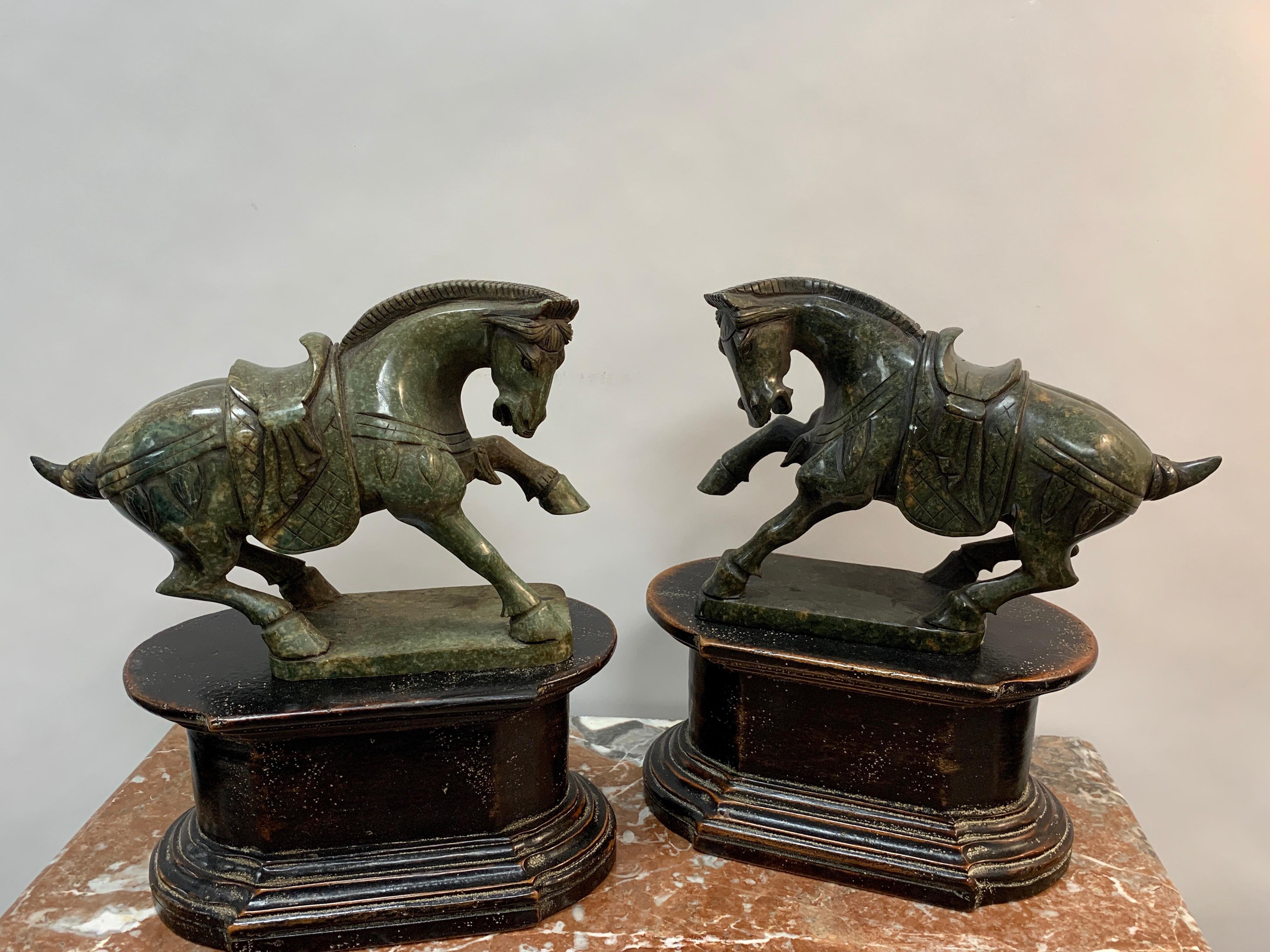 Pair of Chinese export hardstone horses and stands, each one finely carved of a standing horse with one leg up, facing left and right. Removable from the associated lacquered stands. Unmarked.
Two horses alone measure approximately 10