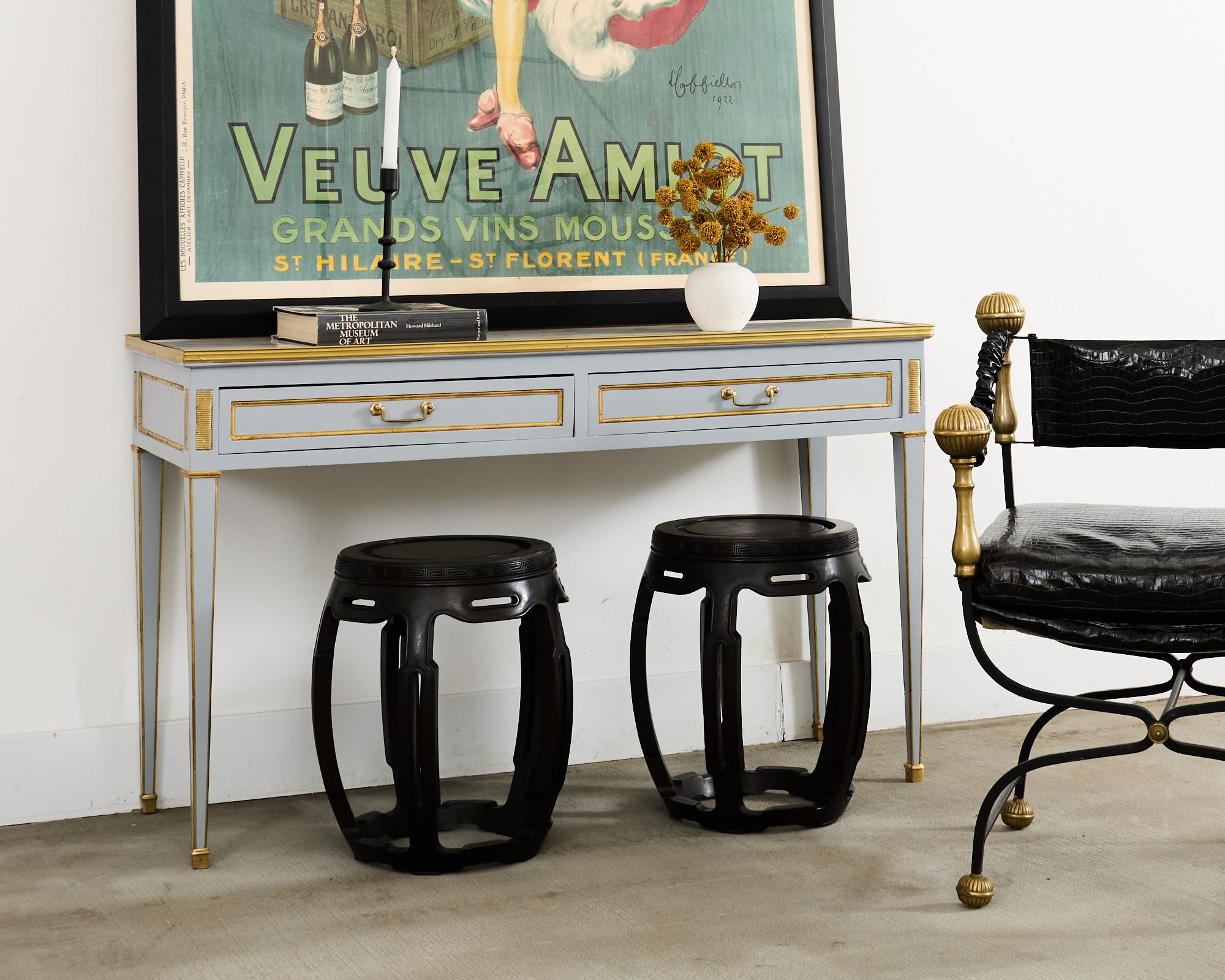 Handsome matching pair of Chinese export carved hardwood garden stools or drinks tables having a round tabouret or drum form. The stools are are sturdy and solid with excellent joinery and craftsmanship. The wood has a dark, rich, near-ebony finish