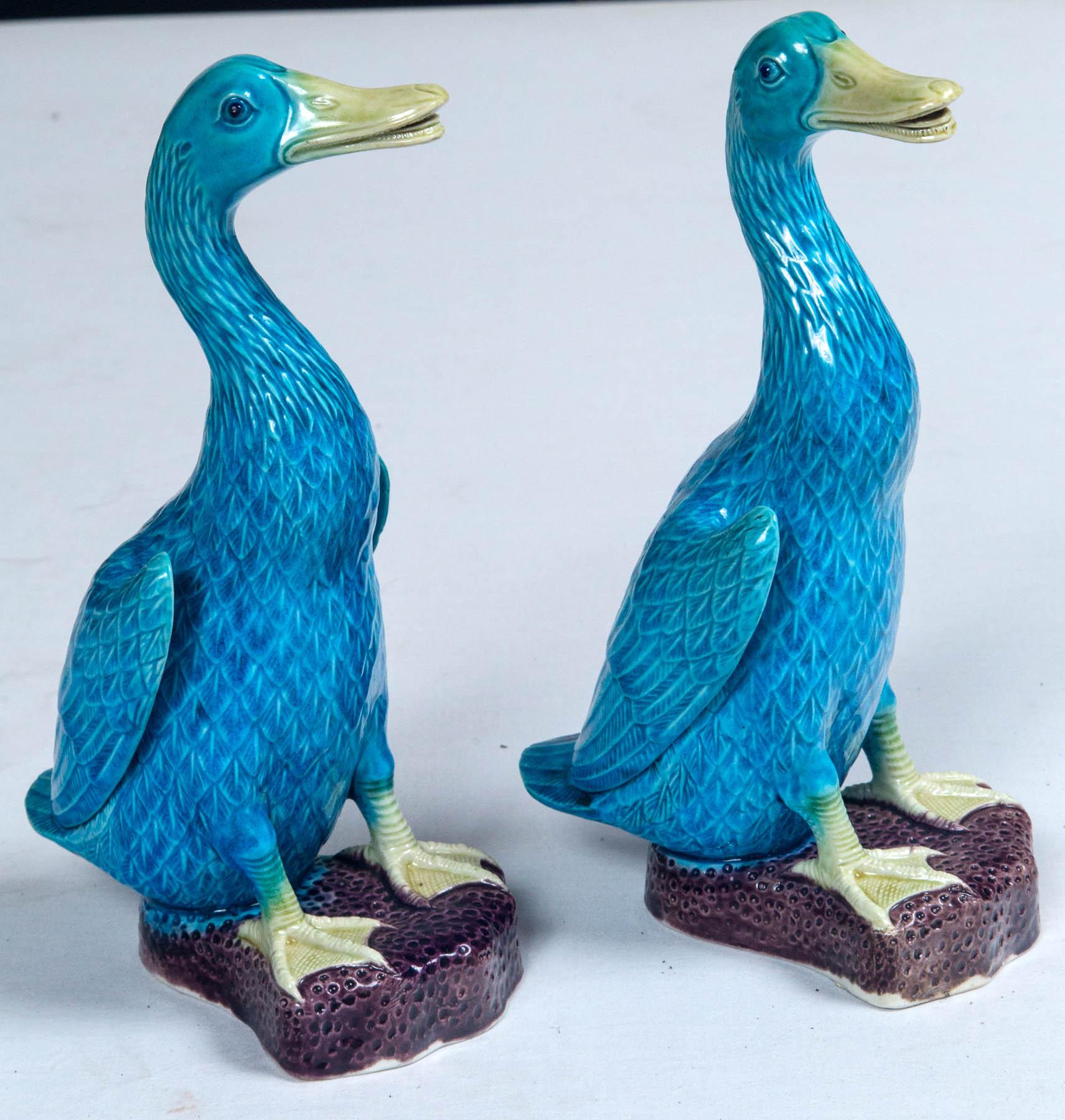 Pair of Chinese export porcelain figural ducks, 20th century. Vibrantly glazed and finely detailed.