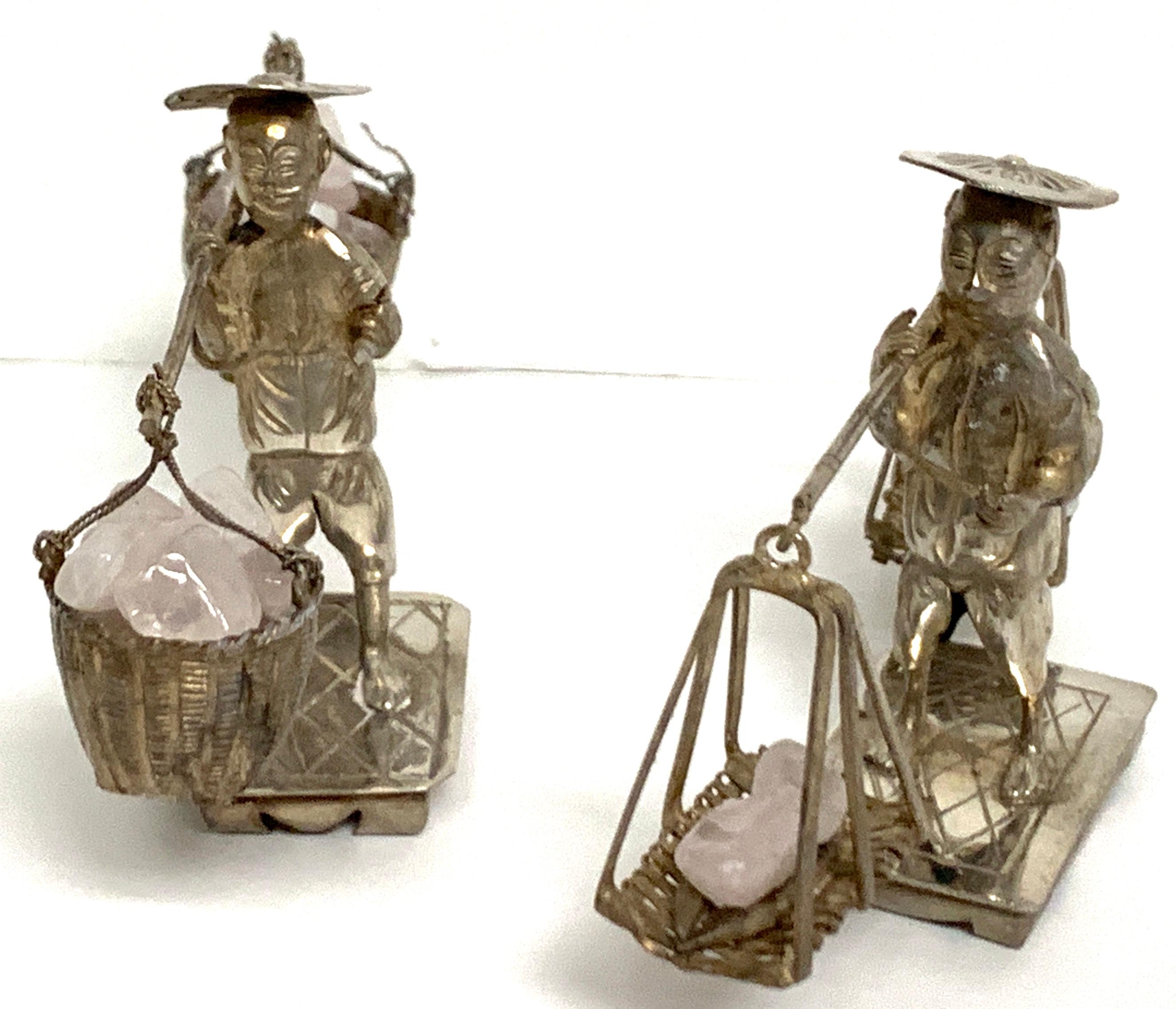 Pair of Chinese Export sterling figures of labourers carrying rose quartz
Each one detailed and realistically cast, both in traditional dress with carrying pole with hanging baskets of polished rose quartz. One is unmarked, one is hallmarked with 85