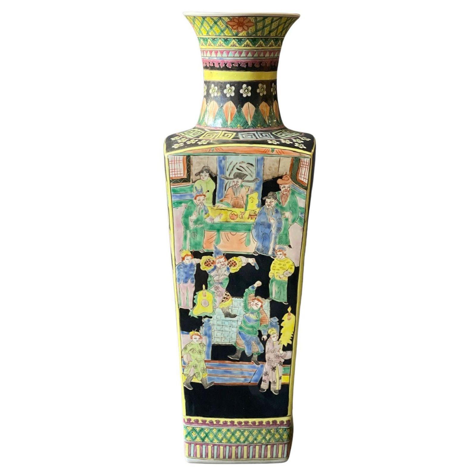 Pair of Chinese Famille Noire porcelain vases with square baluster form with battle scenes and flower patterns around. Made in the 20th Century. 
Dimensions:
23