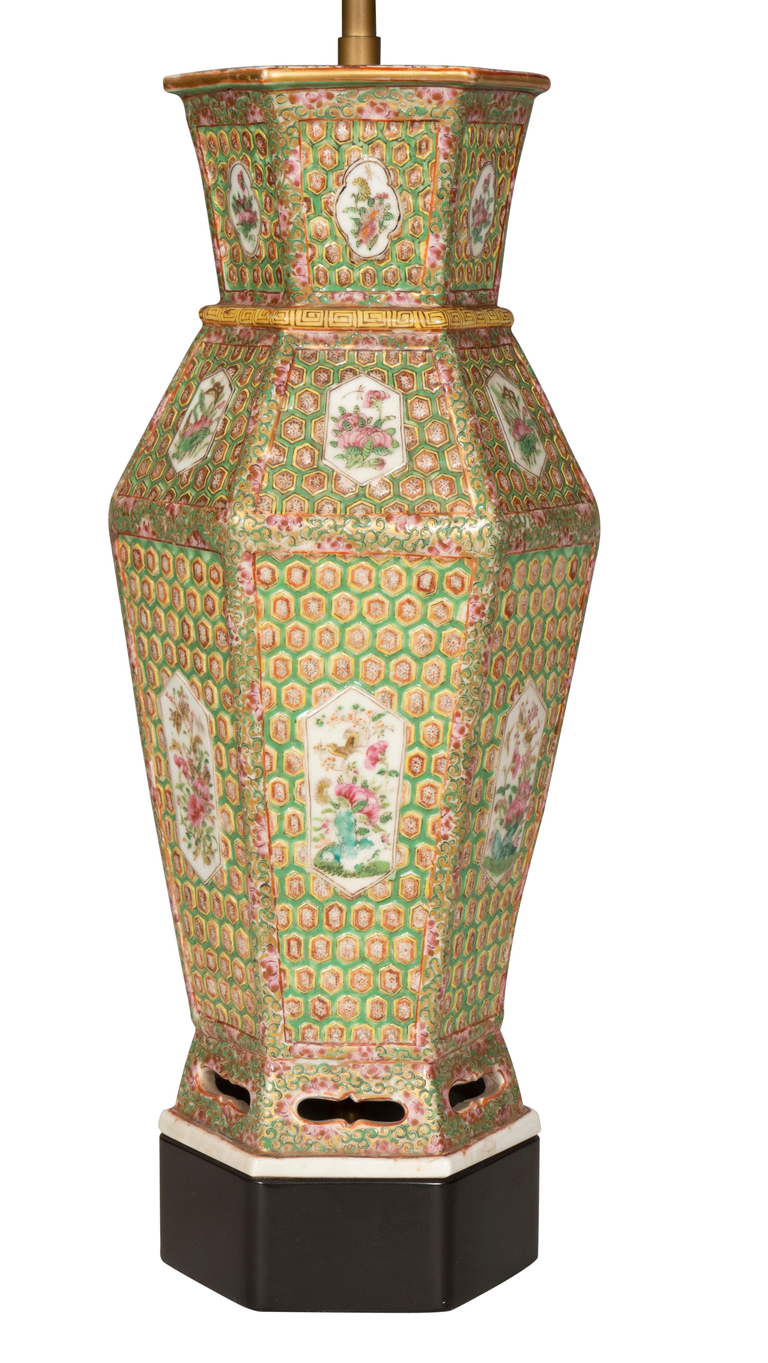 Unusual hexagonal form with overall painted decoration.The base with pierced decoration. Now mounted as lamps.