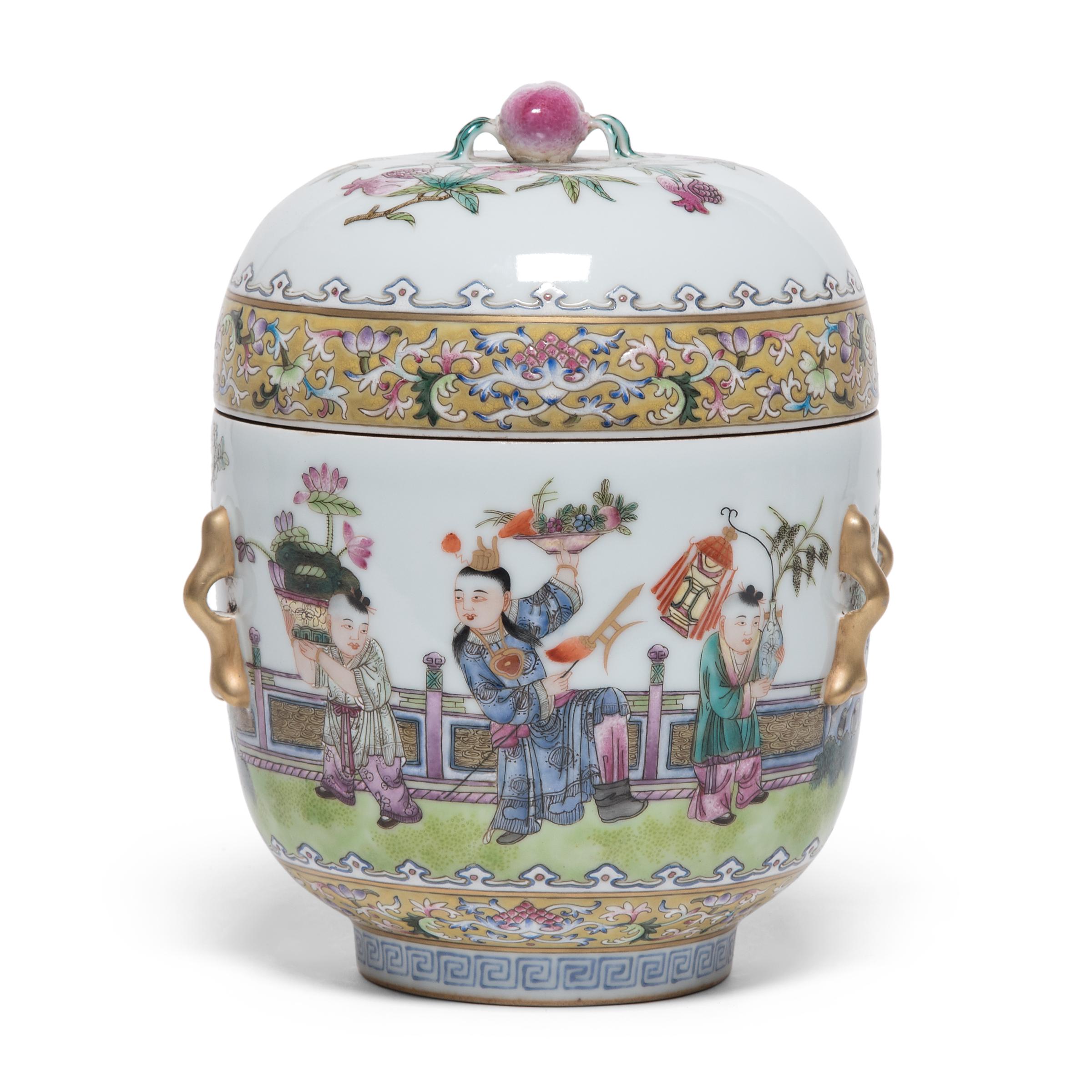 These lovely porcelain jars date to the early 20th century and are finely enameled in the famille rose style with a scene of boys at play in a garden setting. A popular theme in Chinese decorative arts, this scene conveys a wish for many successful