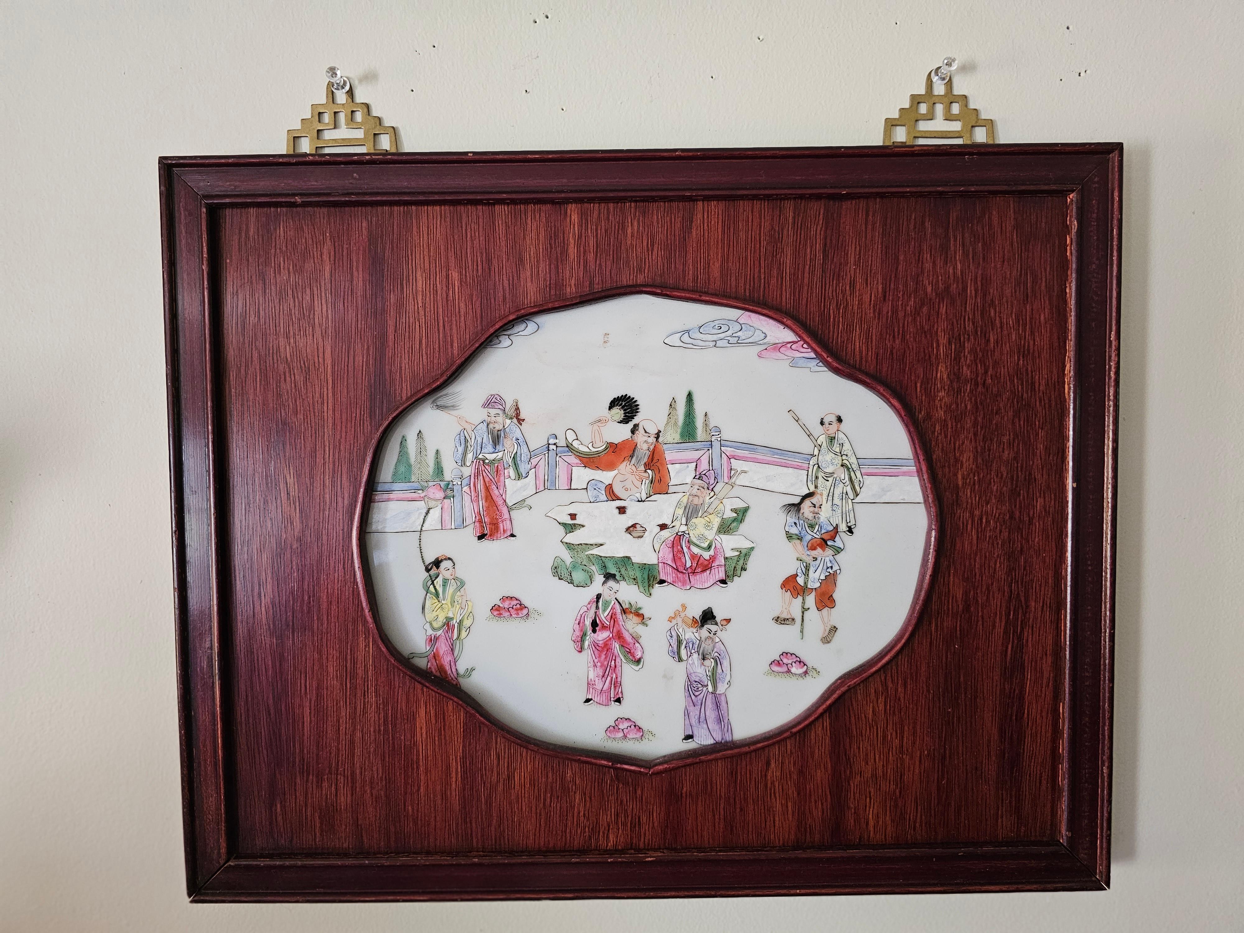 Beautiful Pair Of Chinese Famille Rose hand painted porcelain Plaques Depicting Immortals In Rosewood Frames. Measure 14.5